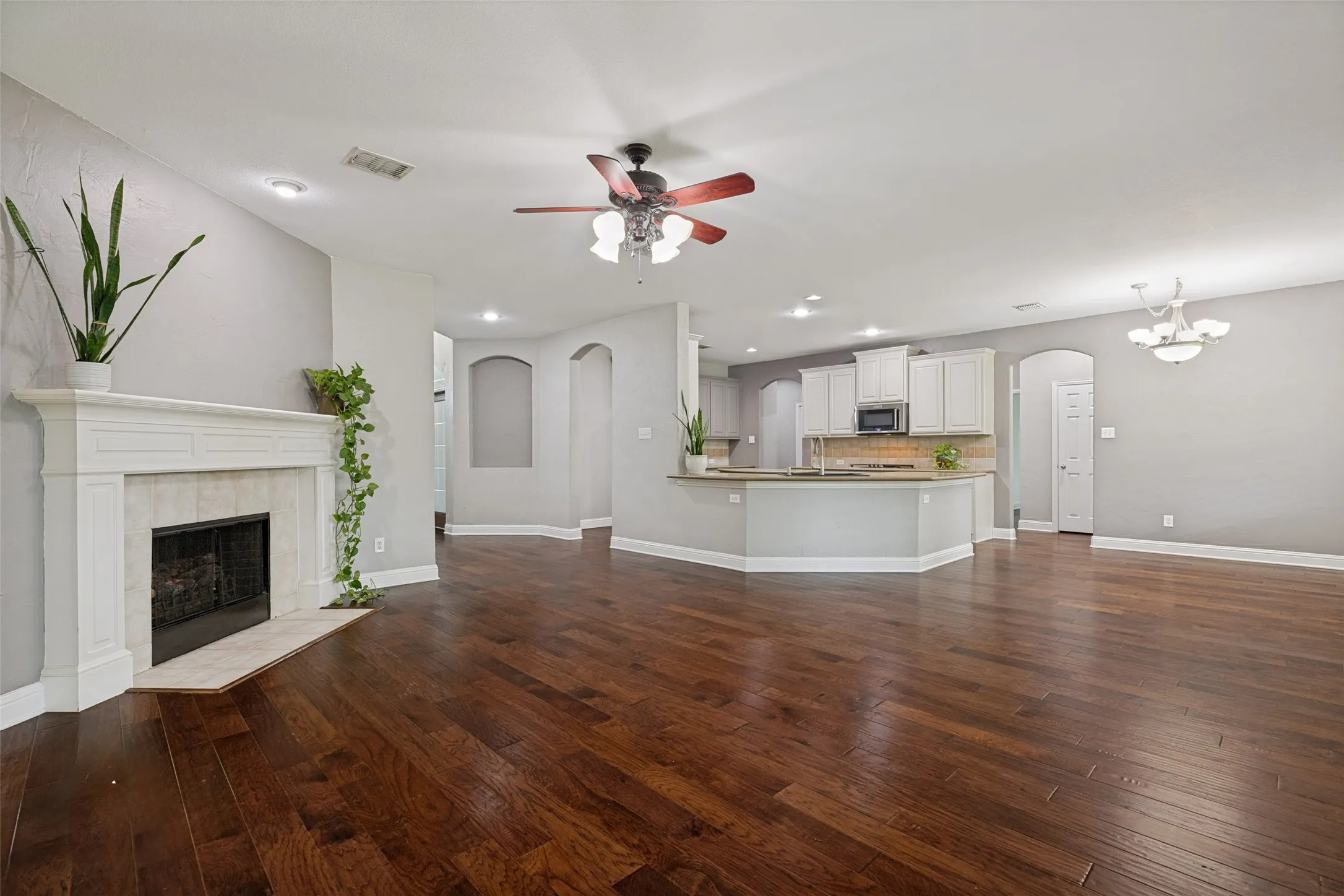 Living area, kitchen, and dining area are all open to one another.