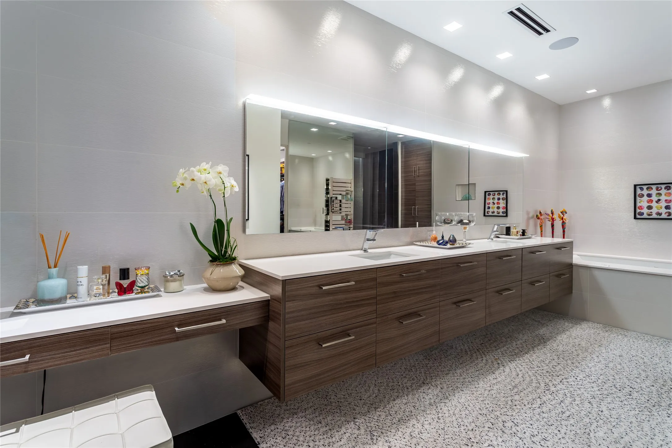 Porcelanosa Primary Bath with makeup table.