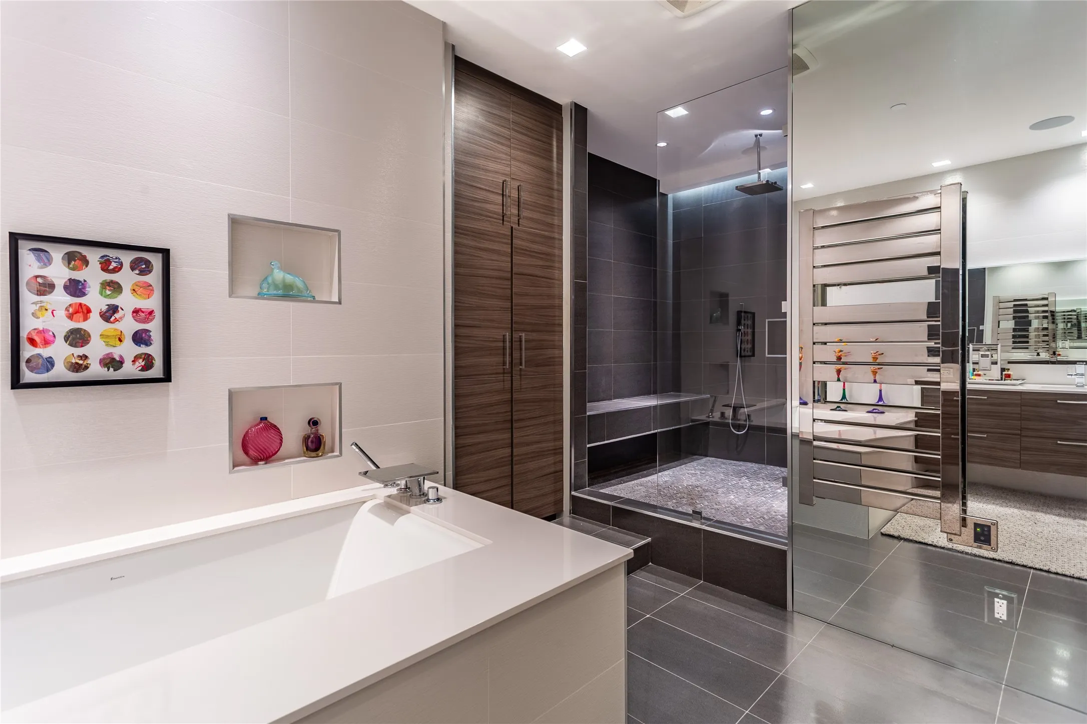 Primary walk-in shower, storage, towel warmer.