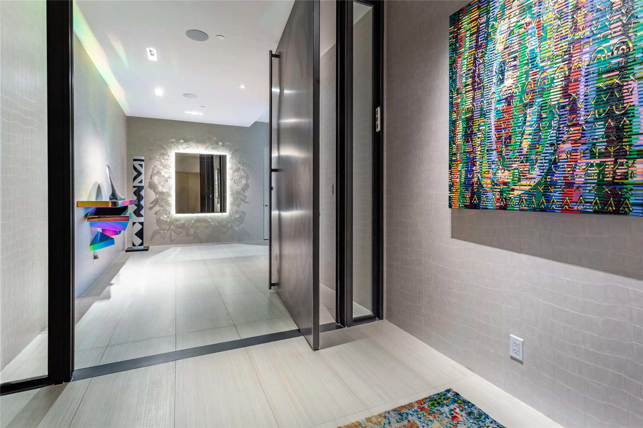 Private Elevator Entry opens to a gracious Foyer.
