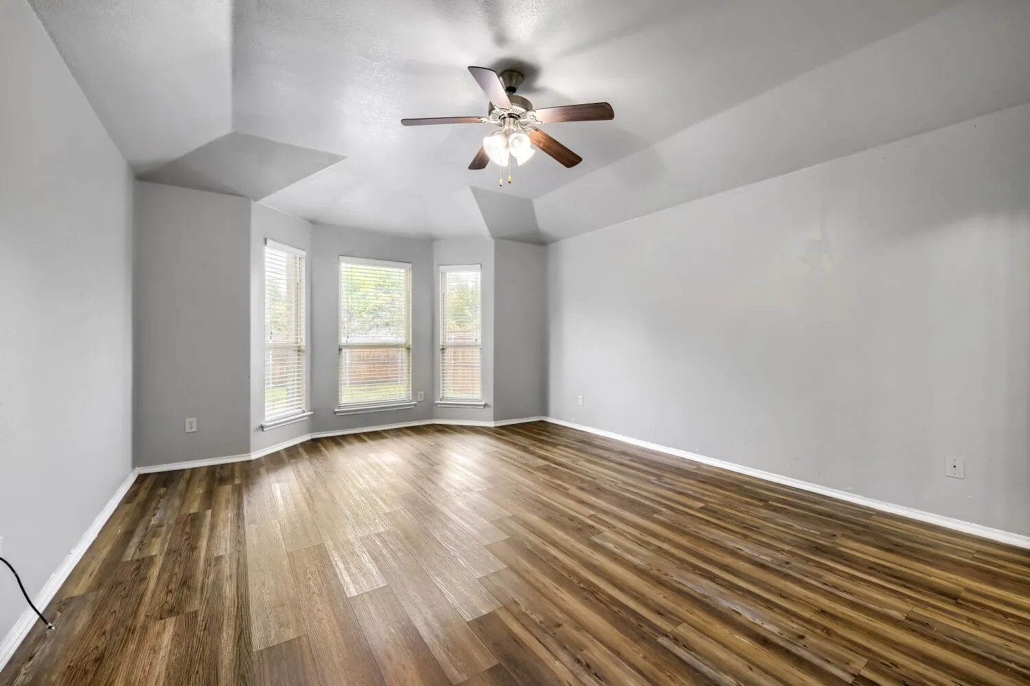 Primary bedroom offering natural light