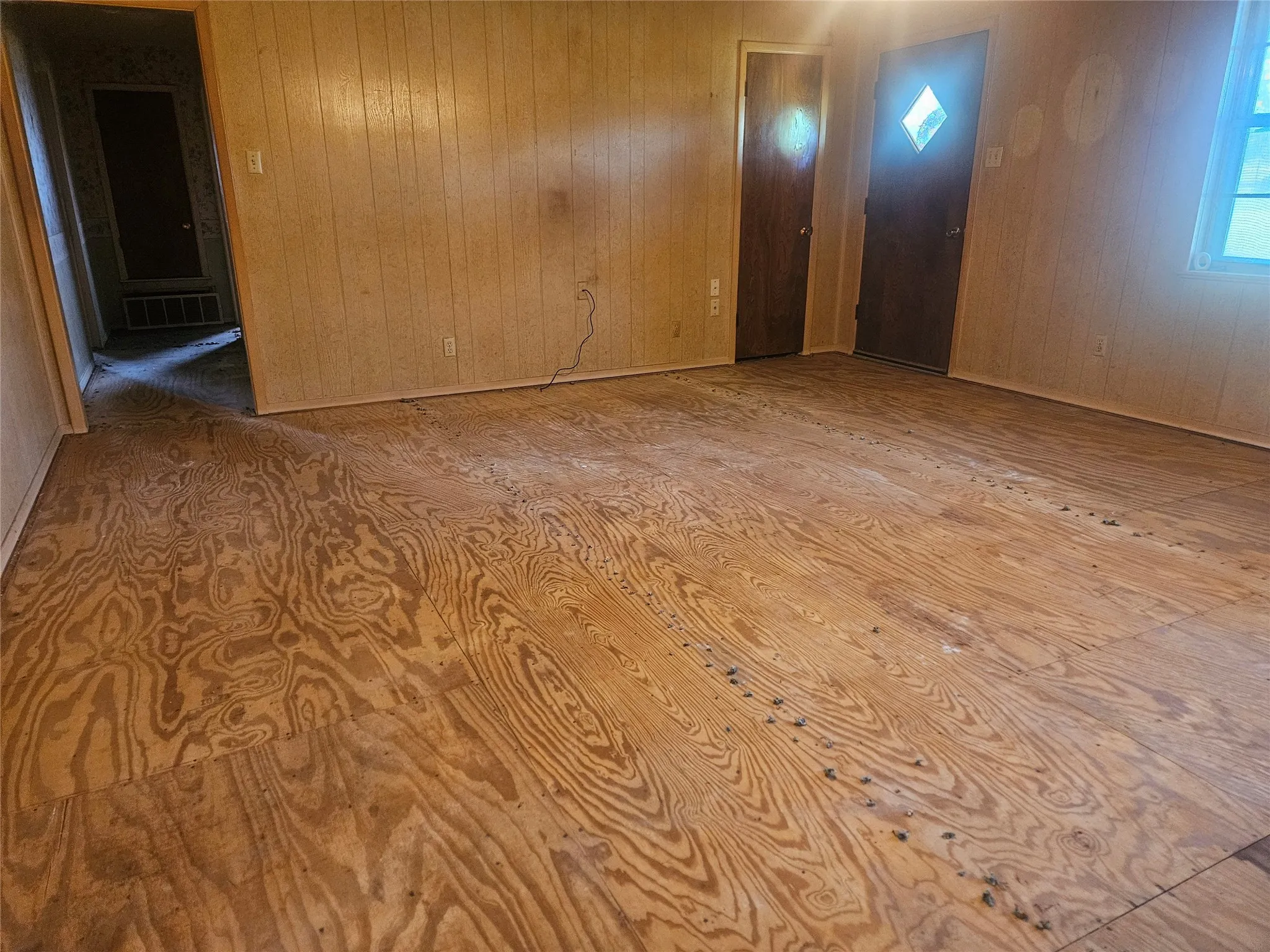 Front door and more of the living room