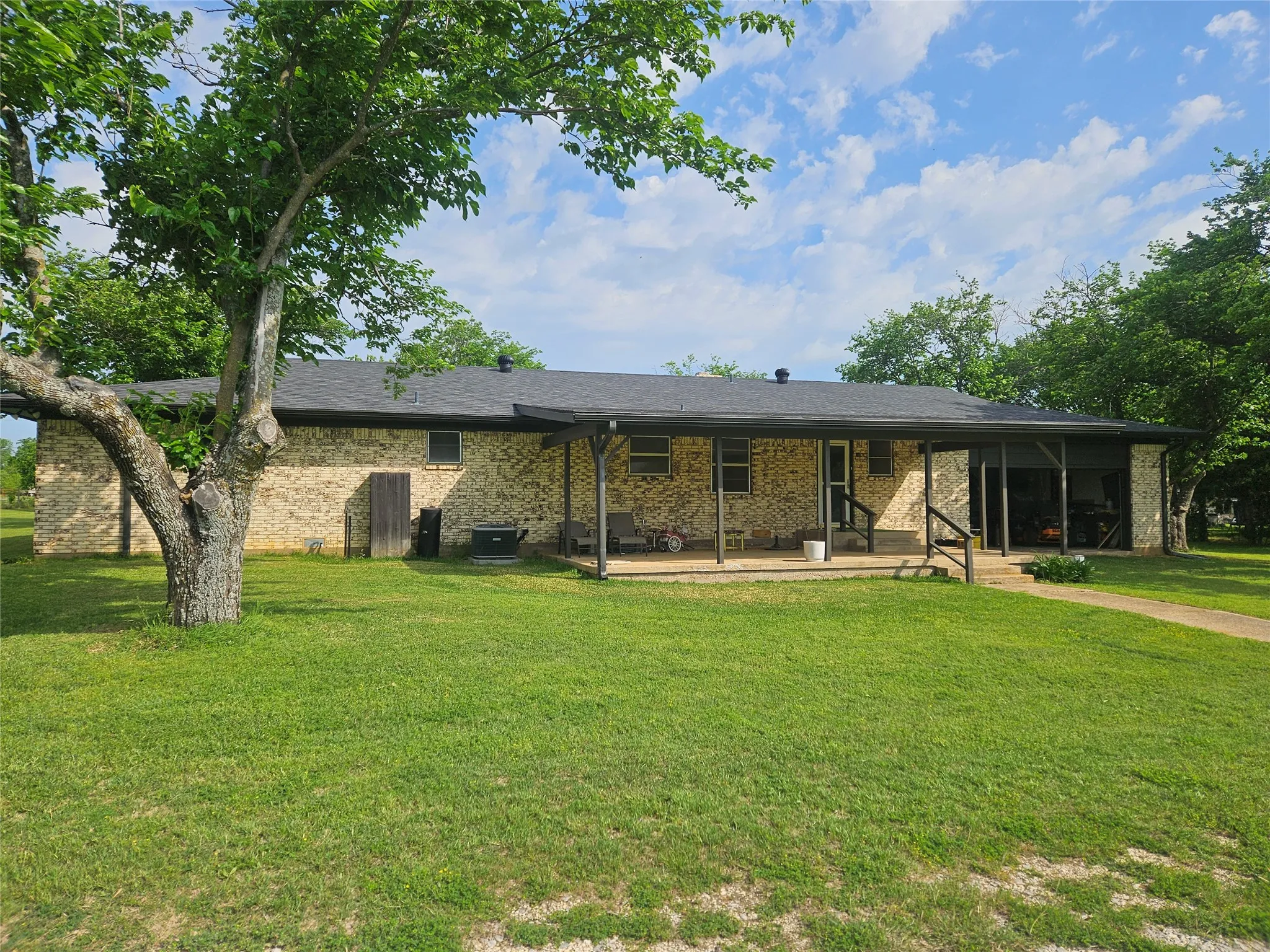 Back porch, covered, oversized double garage