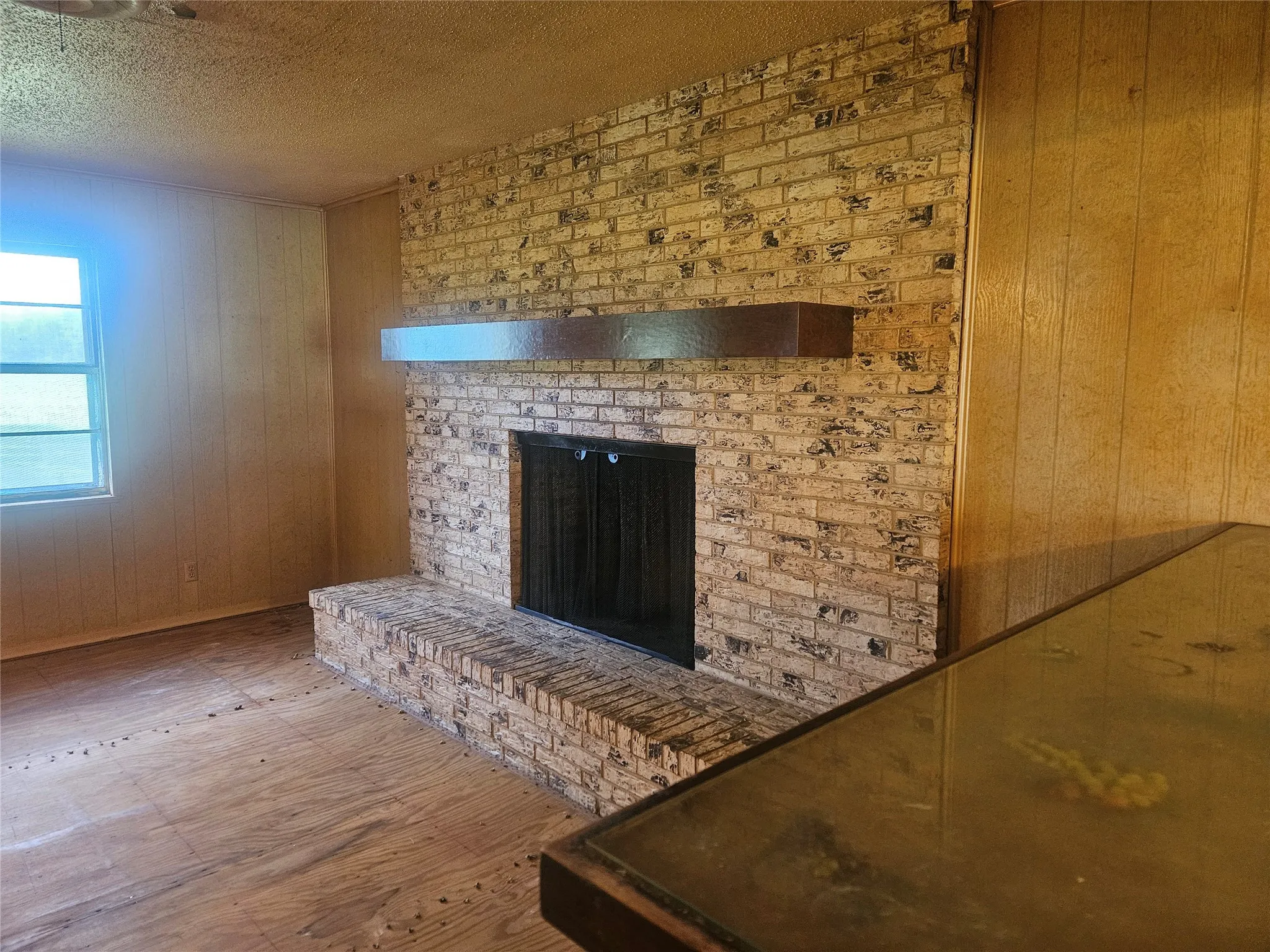 Living room with a wood burning fireplace