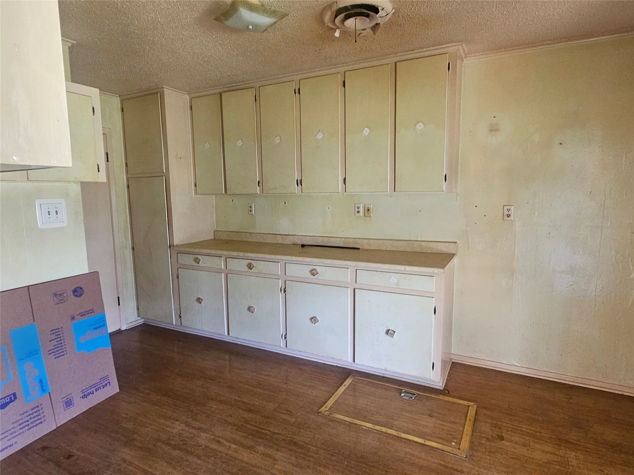 large laundry room with LOTS of counter space and cabinetry
