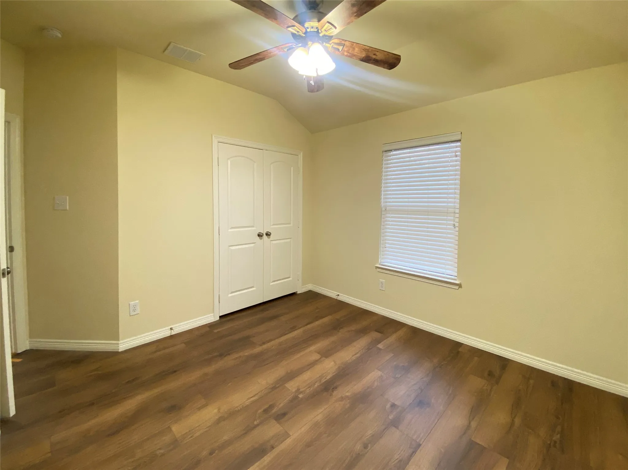 2nd Room featuring wood-finish flooring, a vaulted ceiling, and a ceiling fan with integrated lighting