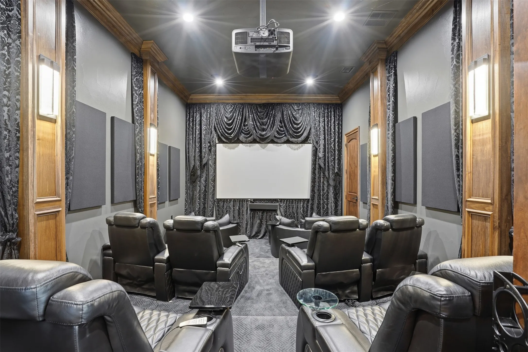 Movie theater with projector, screen, leather chairs