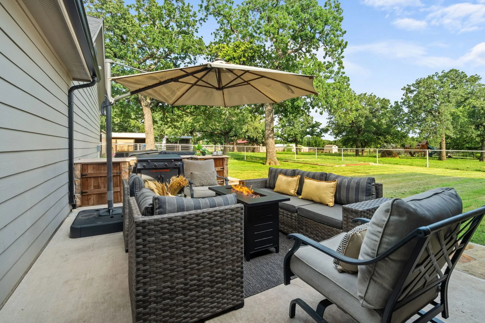 With views of the pasture and animals, the back patio is not only serene and peaceful but also the perfect place to gather, featuring an entertaining space with a built-in prep station for your grill—made for cookouts and star-lit conversations.