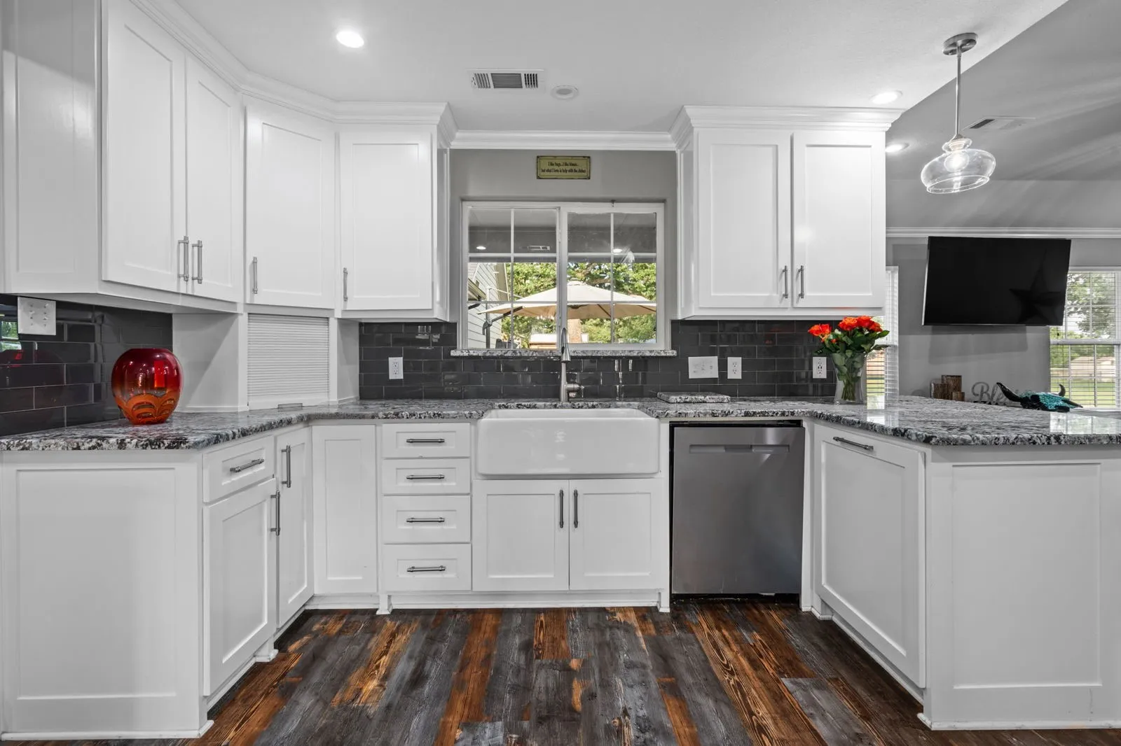 Watch animals run free through the farmhouse sink window in the kitchen that boasts granite, stainless appliances, a pot filler, appliance garage, double ovens (conv. microwave), custom pull-out pantry & coffee bar+insta-hot water.