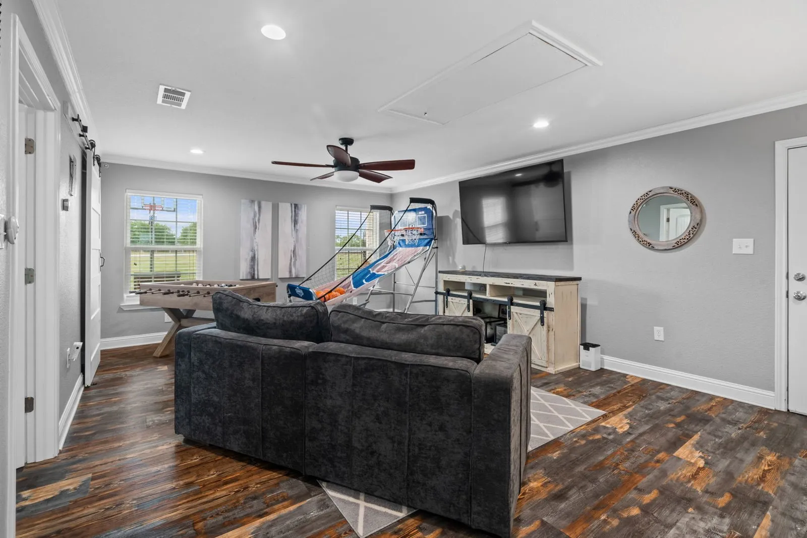 This home has a private wing that includes another living, full bath with walk-in shower, walk-in closet & access to garage, backyard & drop zone area.