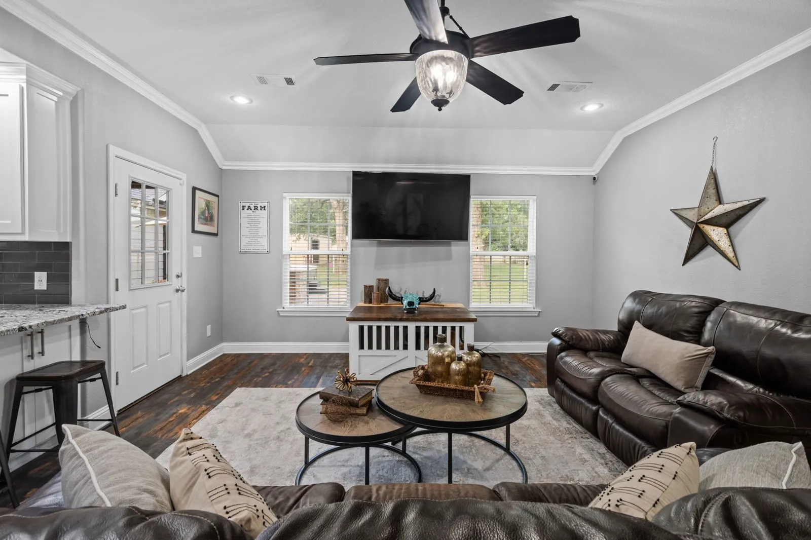 Plantation shutters & farmhouse-inspired luxury vinyl floors add charm & elegance throughout.
