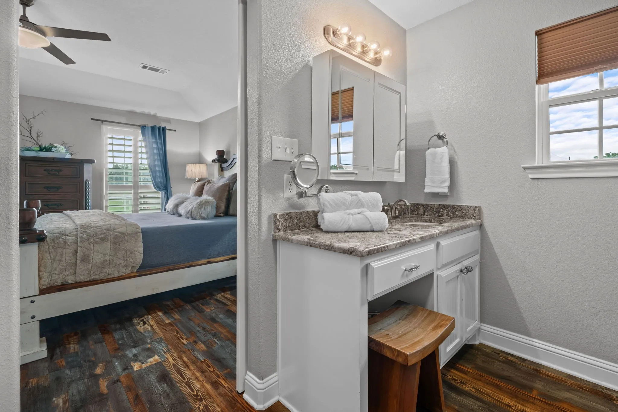 Primary bed features an oversized tiled shower, 2 granite vanities & a two-compartment walk-in closet, one can double as a storm shelter.