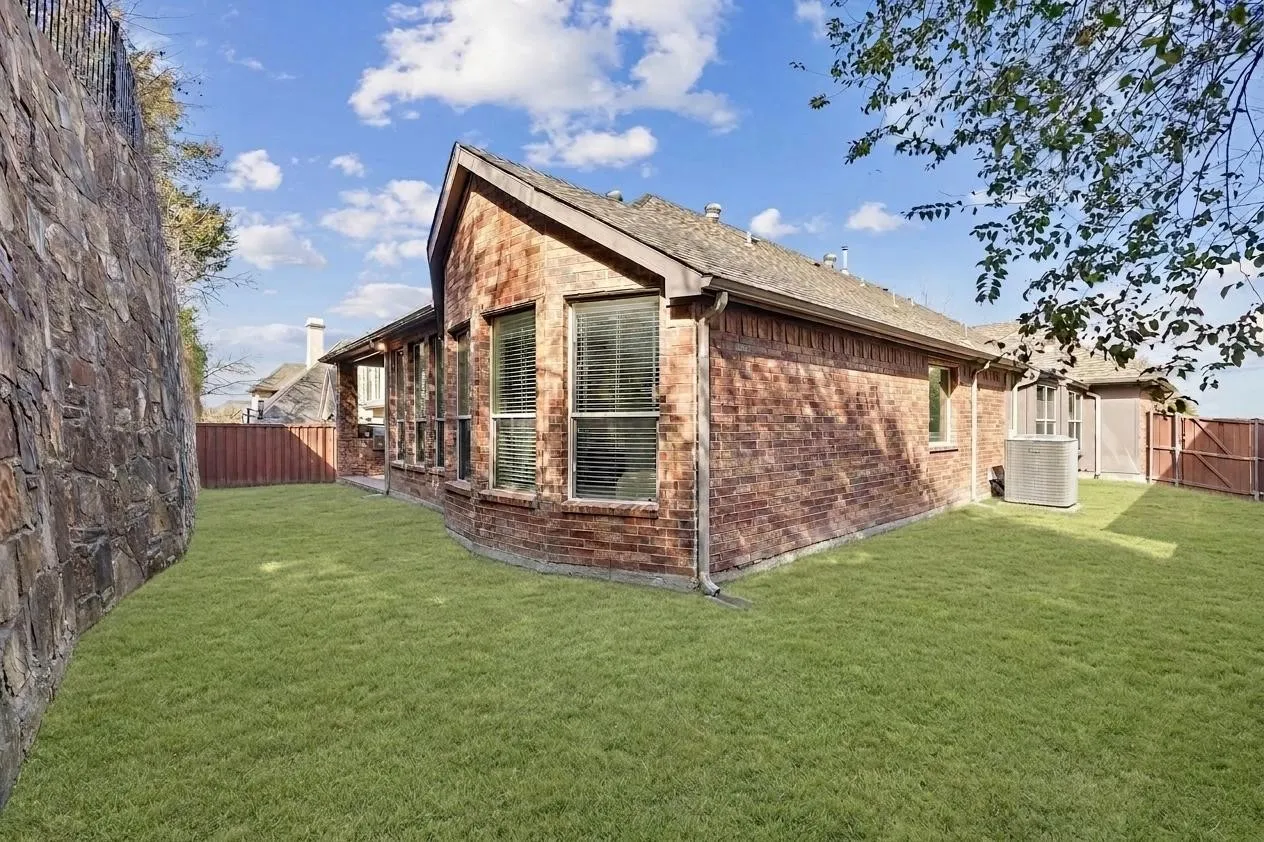 Low maintenance yard is easy to manage, and has lots of natural shade.