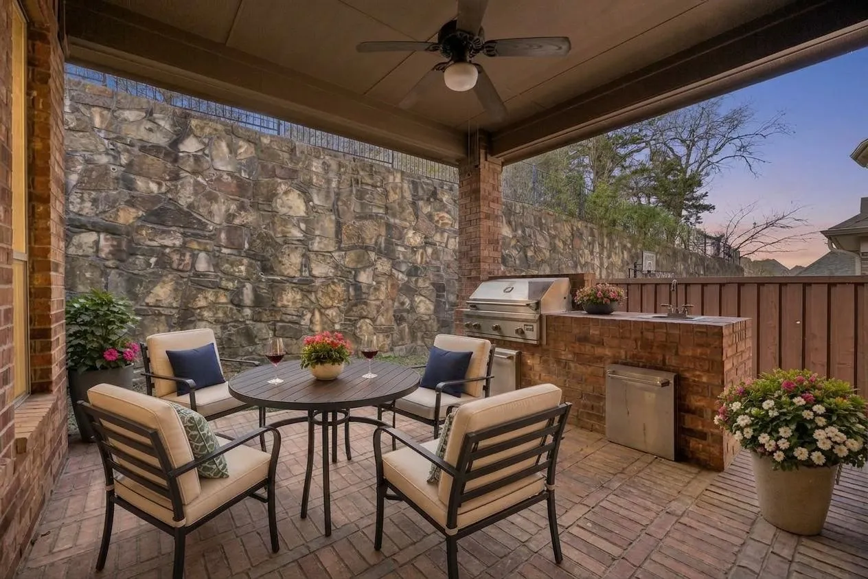 Outdoor living made easy with a covered patio, built-in grill, and a private low-maintenance setting. Step outside to sunset views.