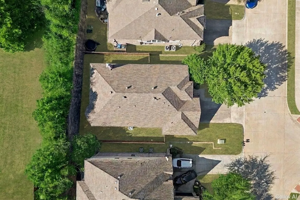 Aerial view of manageable yard in this stunning updated one story in McKinney TX.