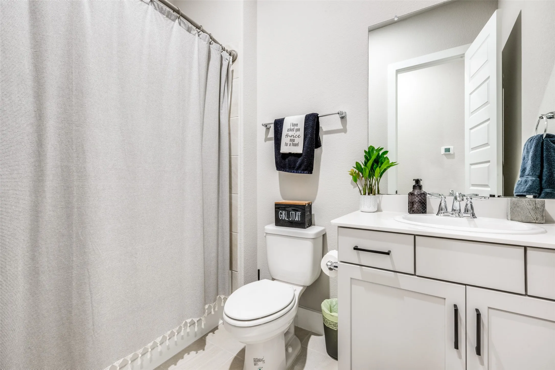 All bathrooms feature modern cabinets and counter tops. This one is ideal for your guests!