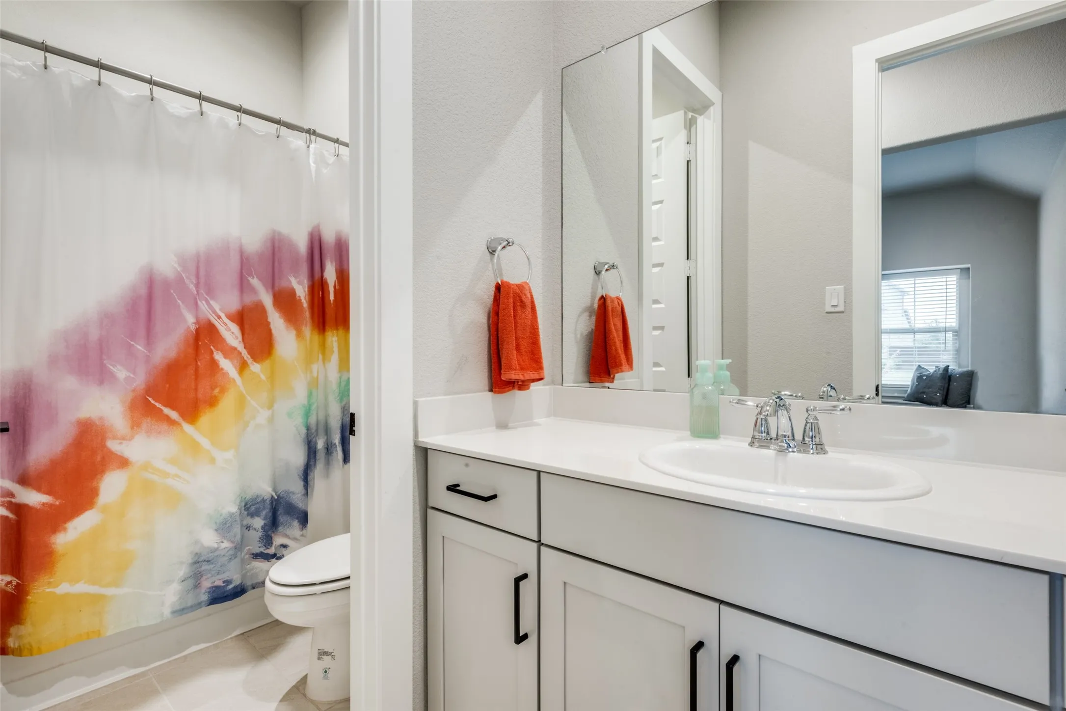 All bathrooms have modern cabinetry and counter tops. This one is perfect for your secondary bedrooms!