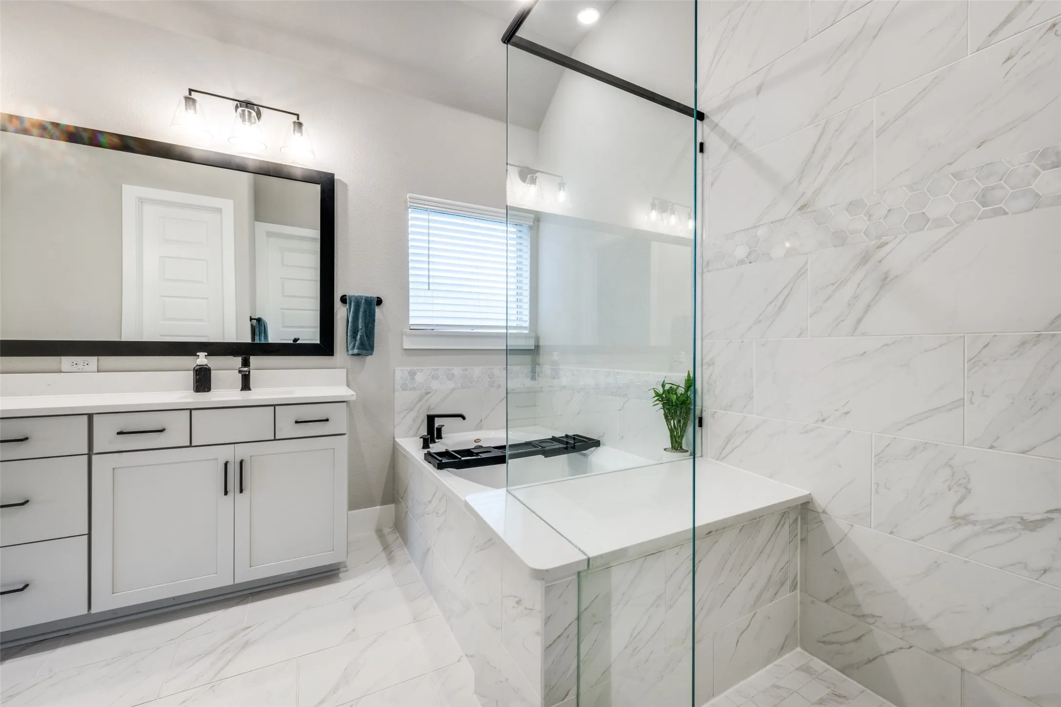 The perfect place to relax after a long day. Beautiful tile and cabinets add luxury to the comfort.