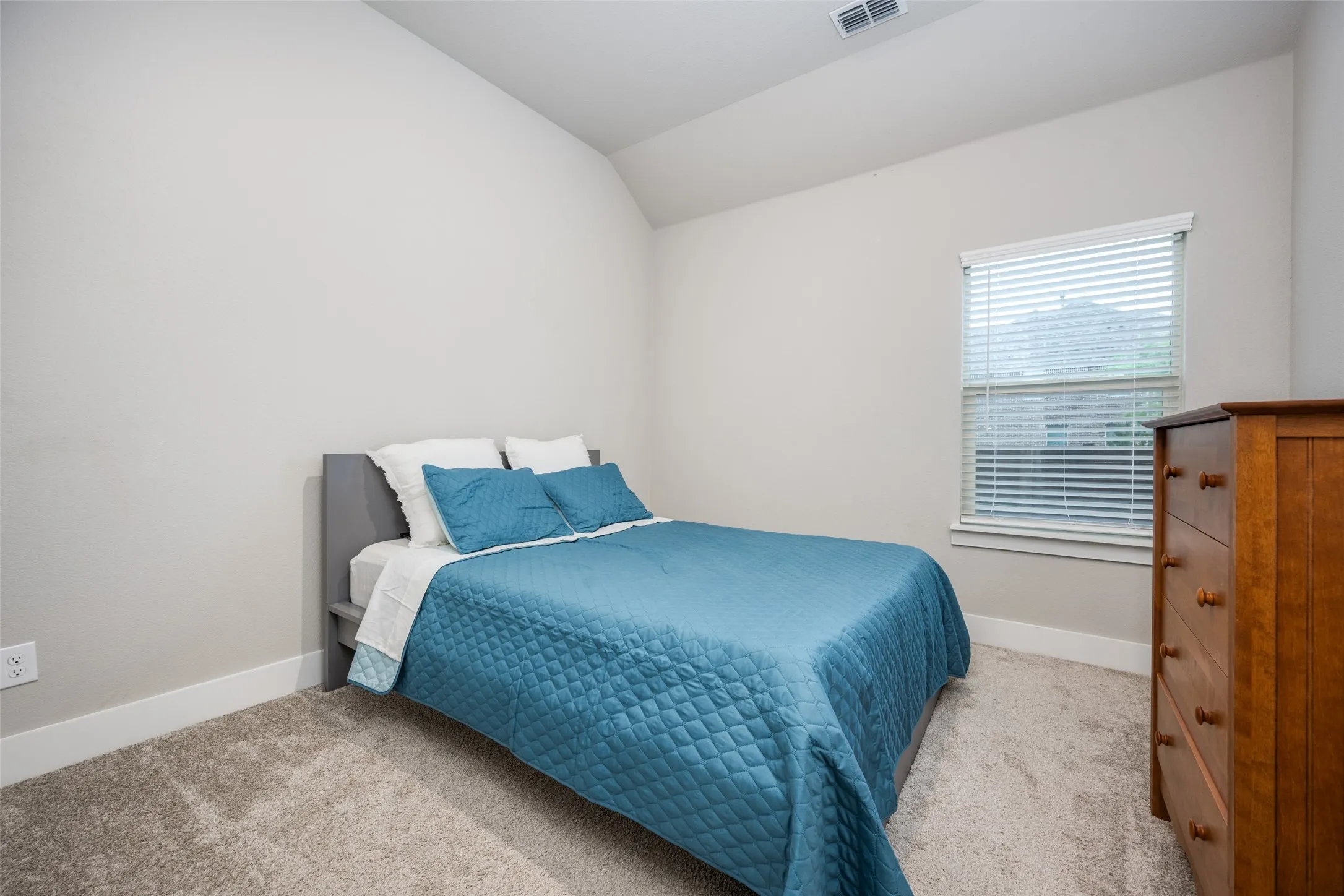 Secondary bedrooms have tall ceilings and walk in closets.