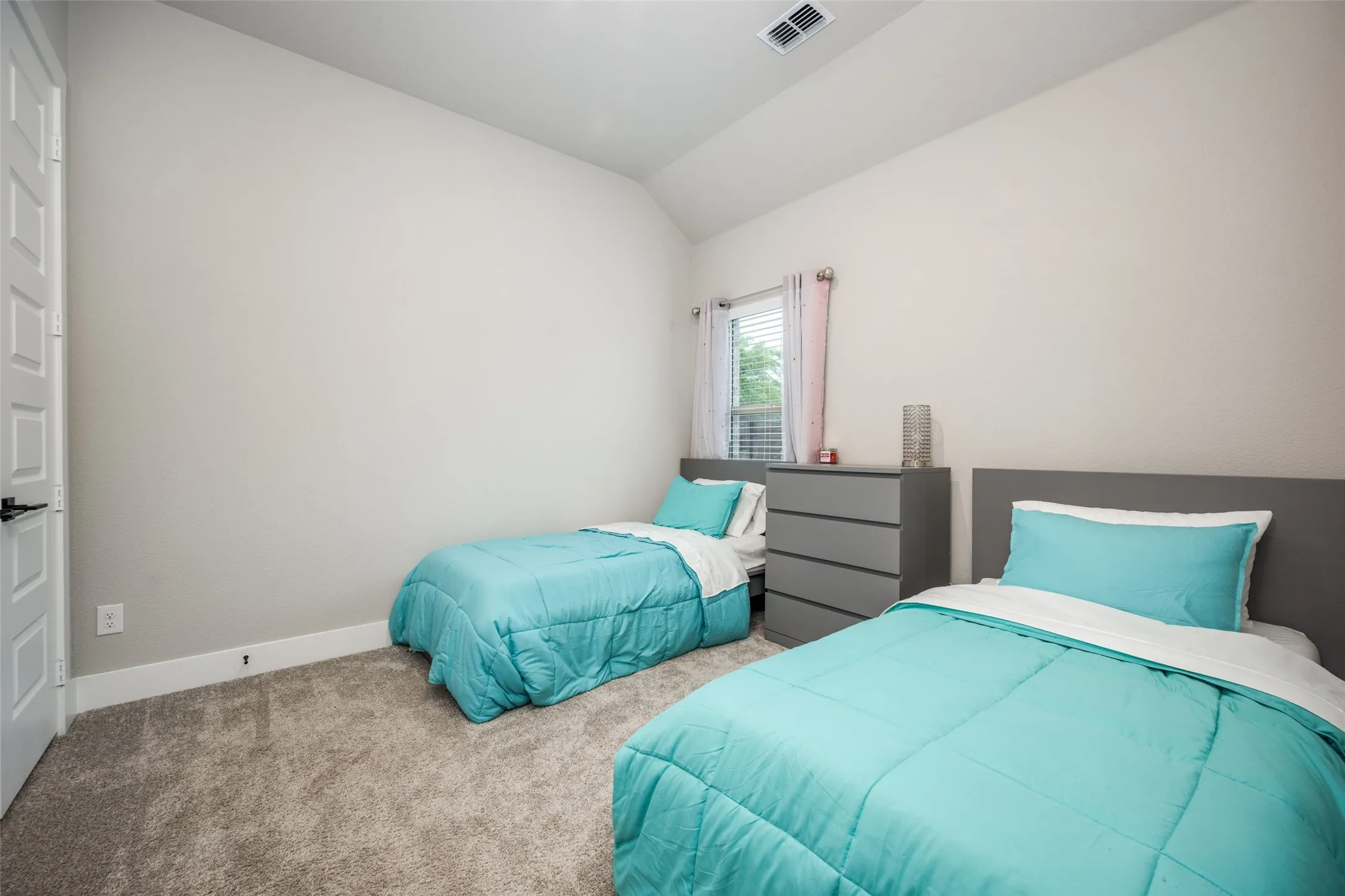 Spacious secondary rooms with walk-in closets.