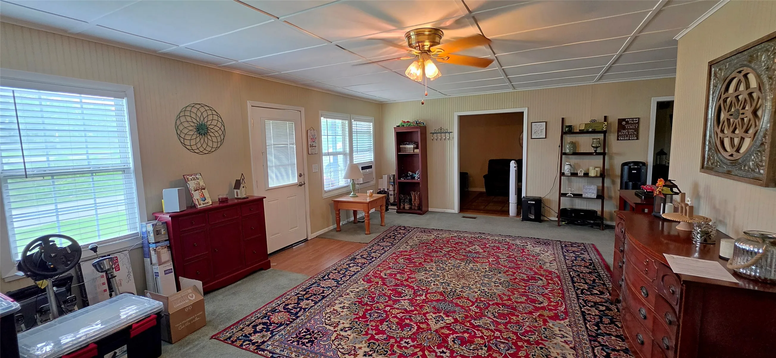 Large living area with lots of light from the front windows.