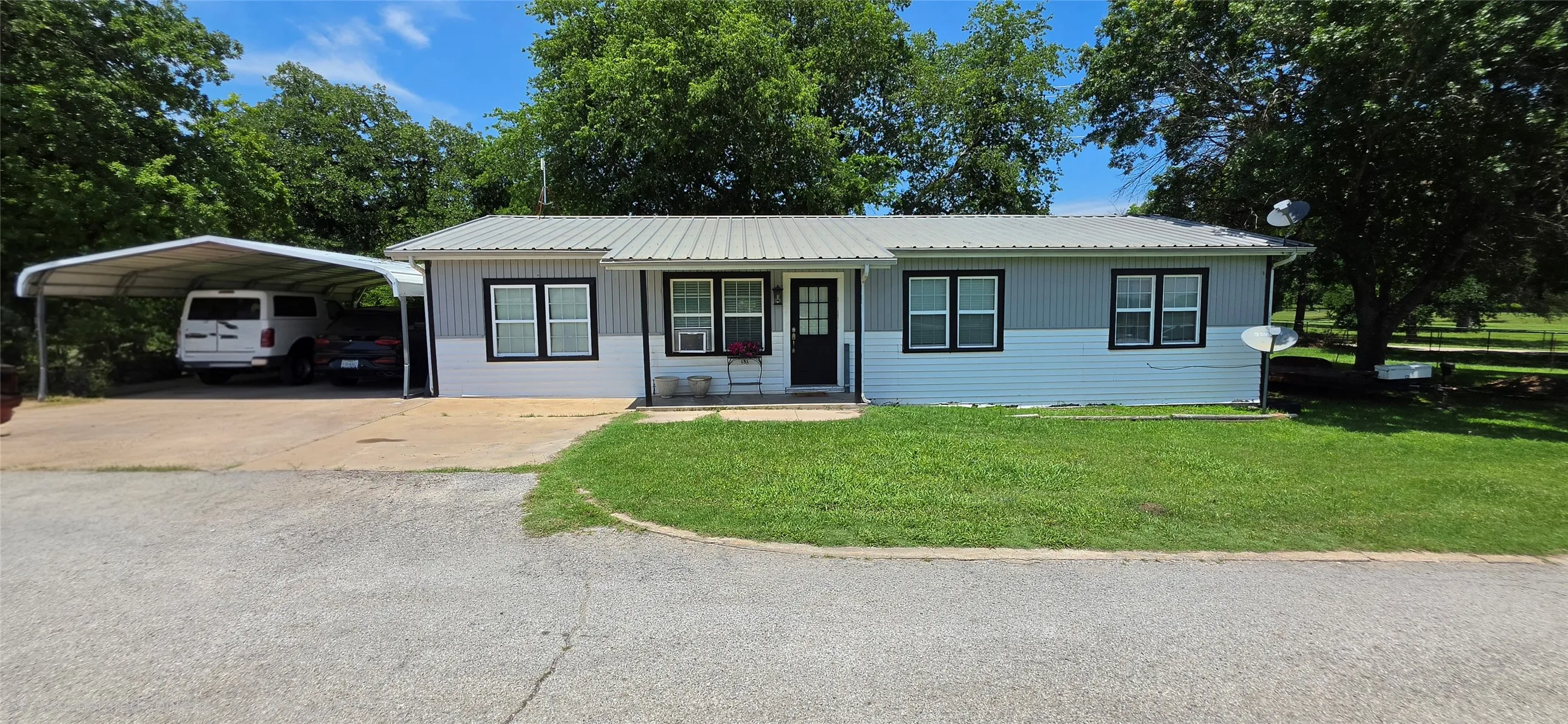 Front of two bed, one bath home.