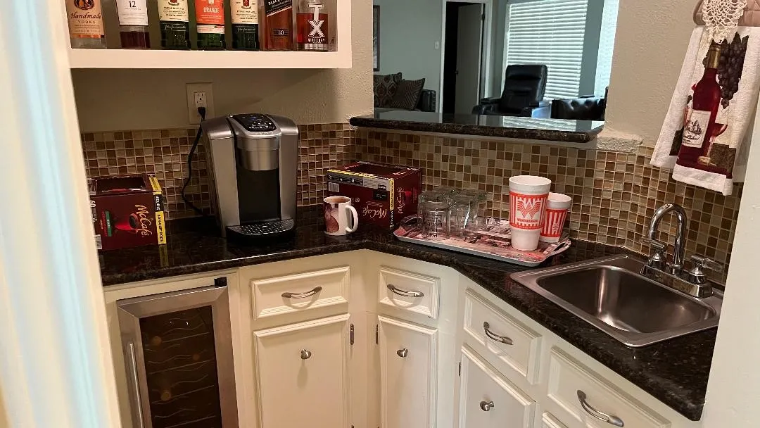 With bar off of kitchen