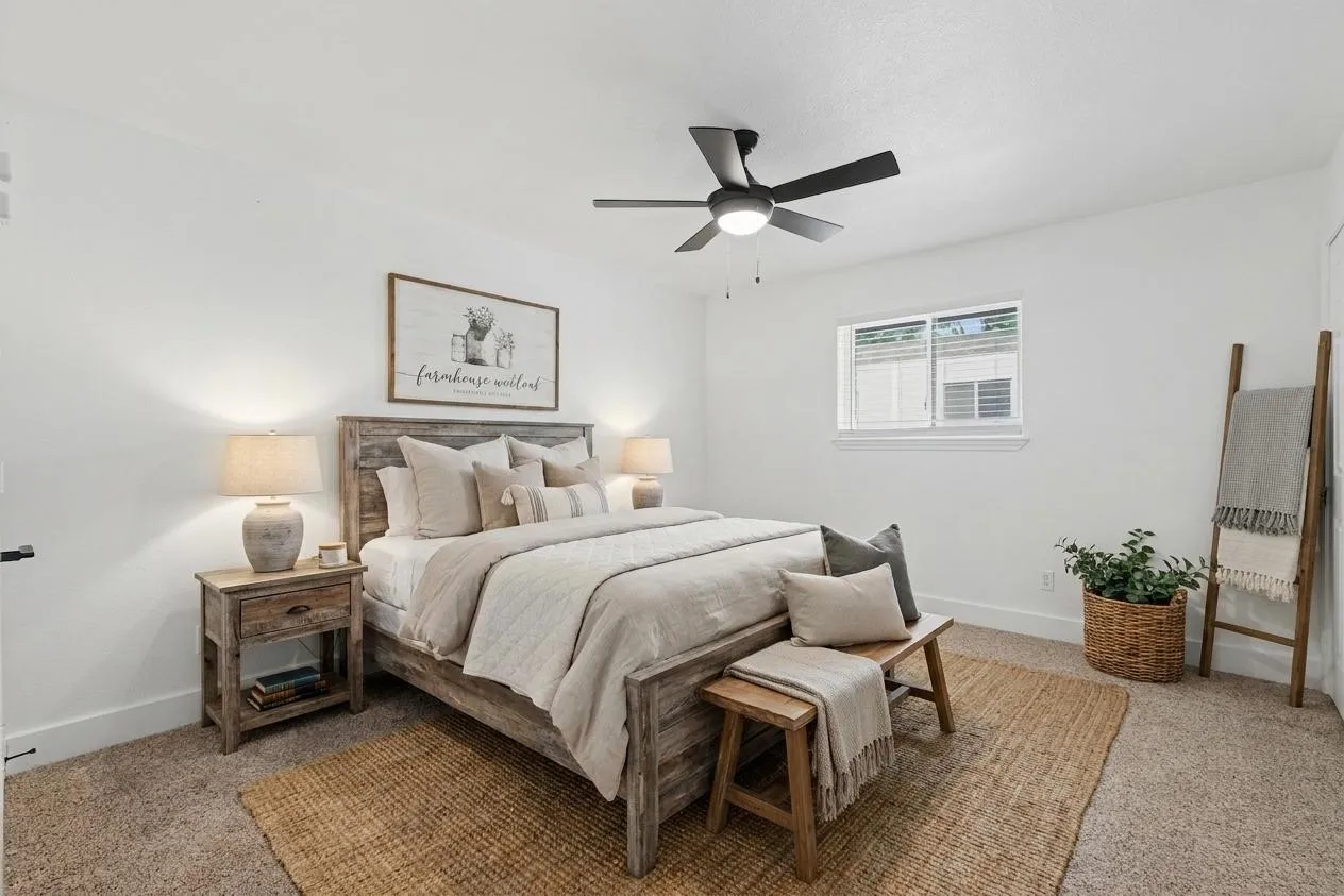 Virtually staged primary bedroom with ample space and neutral finishes