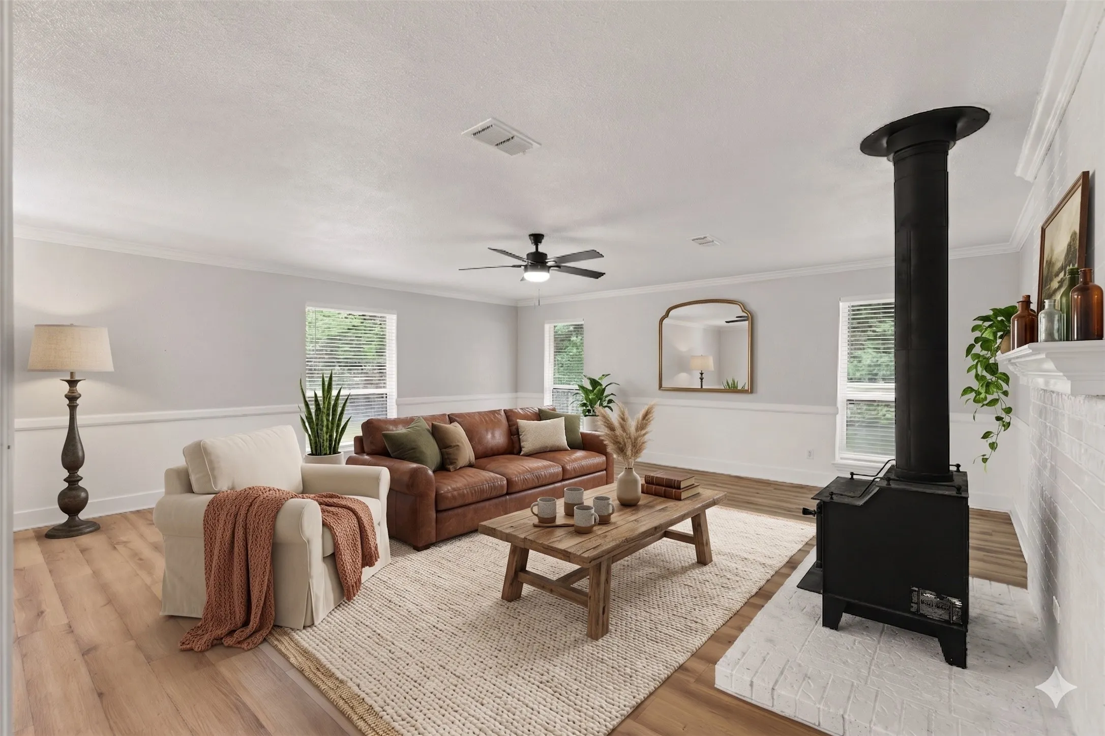 Virtually staged living room anchored by a classic brick hearth and warm plank flooring