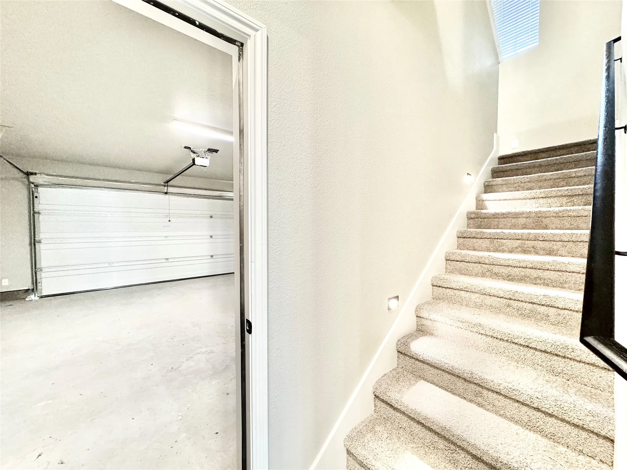 Stairway featuring concrete floors