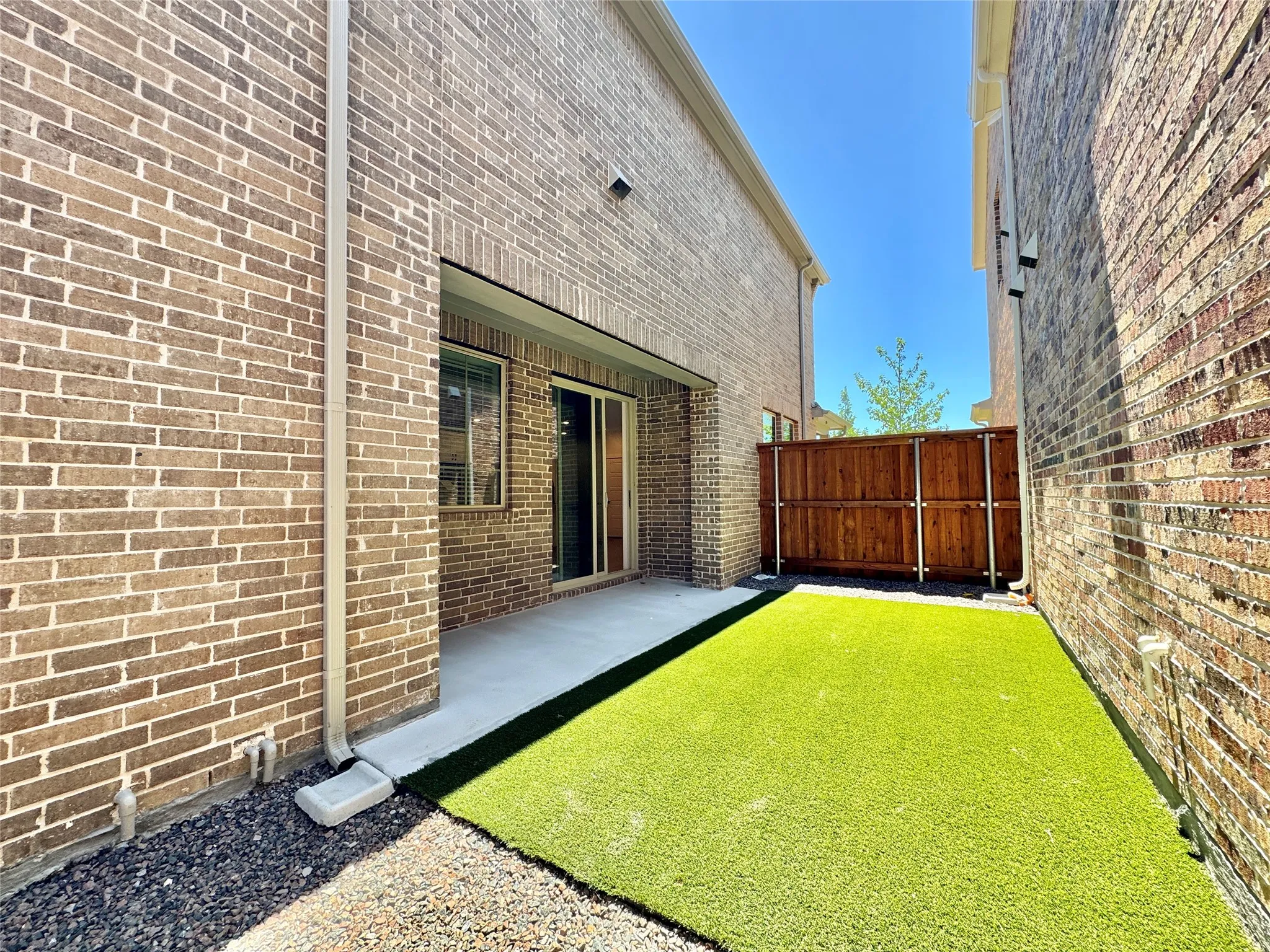View of yard with fence and a patio area