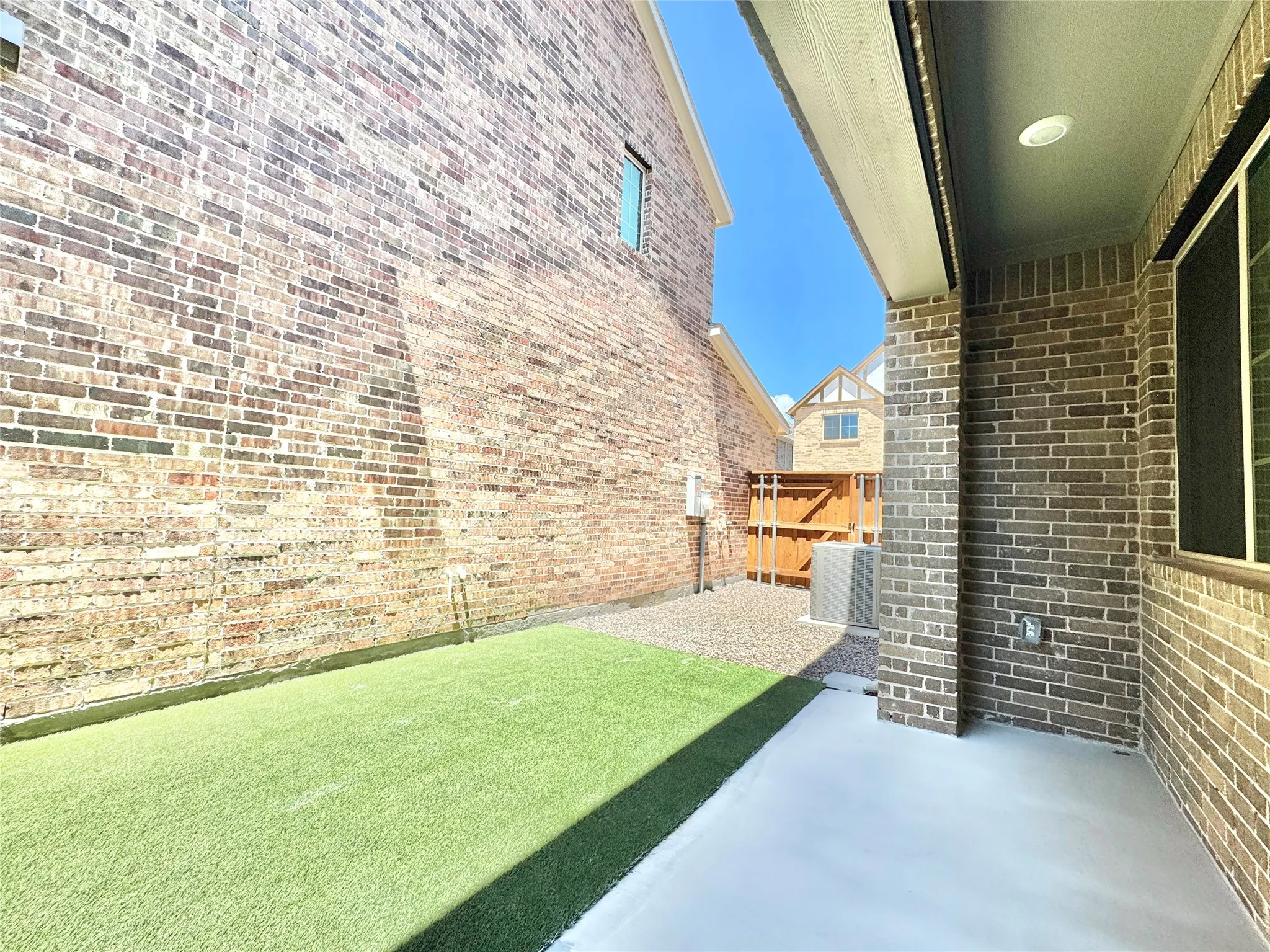 View of yard with central air condition unit and a patio area