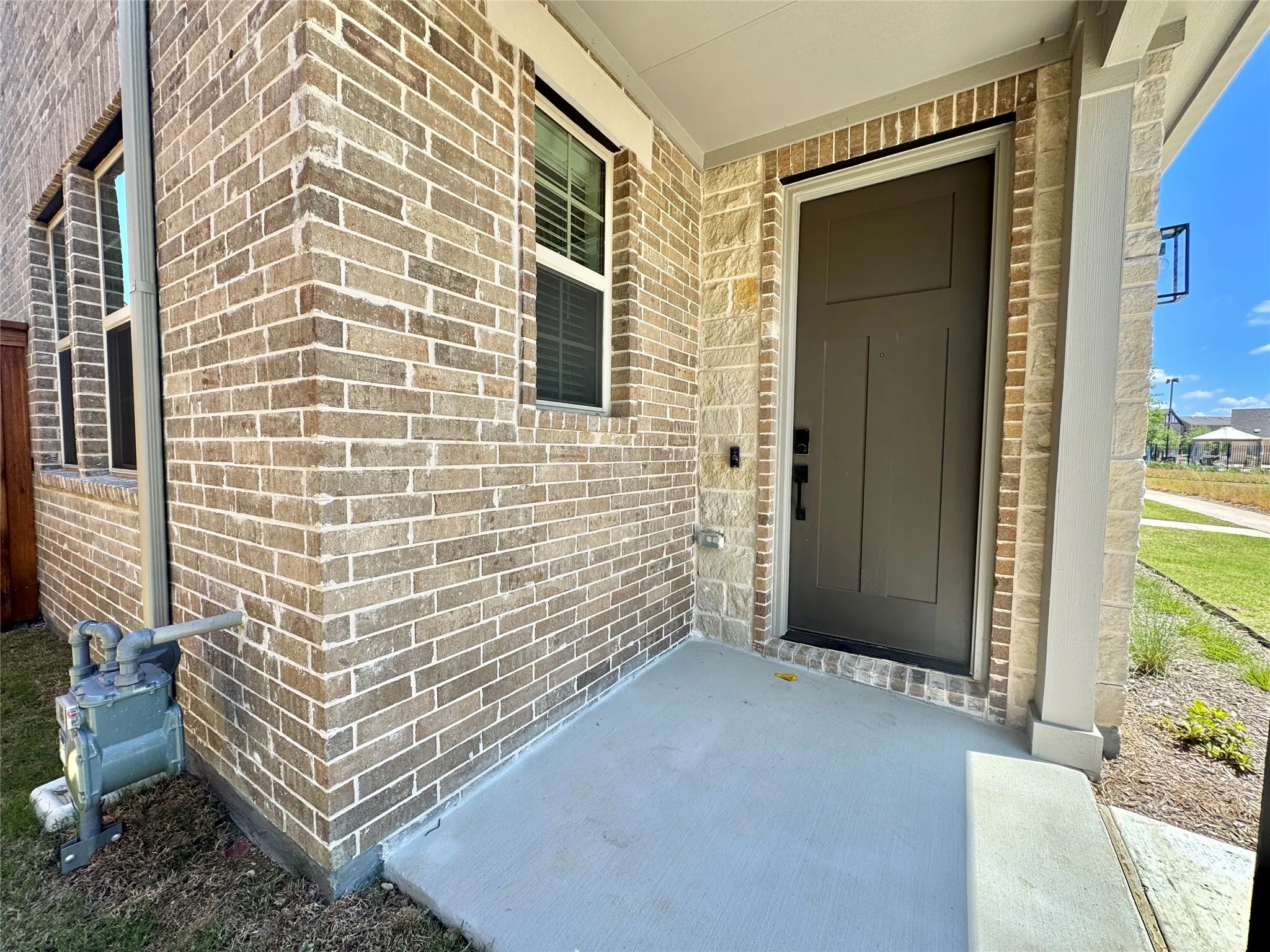 Property entrance with brick siding