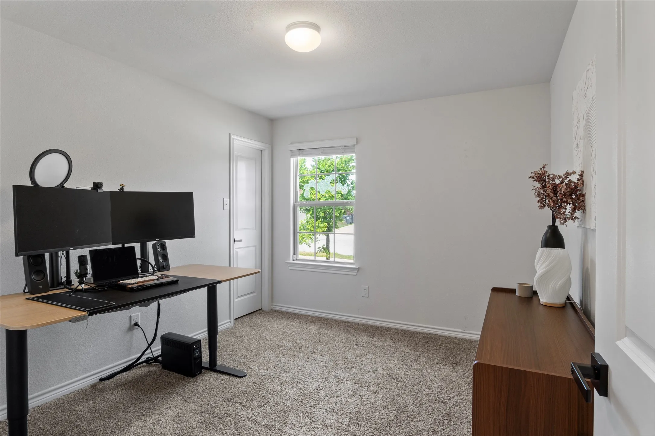 Room featuring light grey walls, a single window, and carpeted flooring
