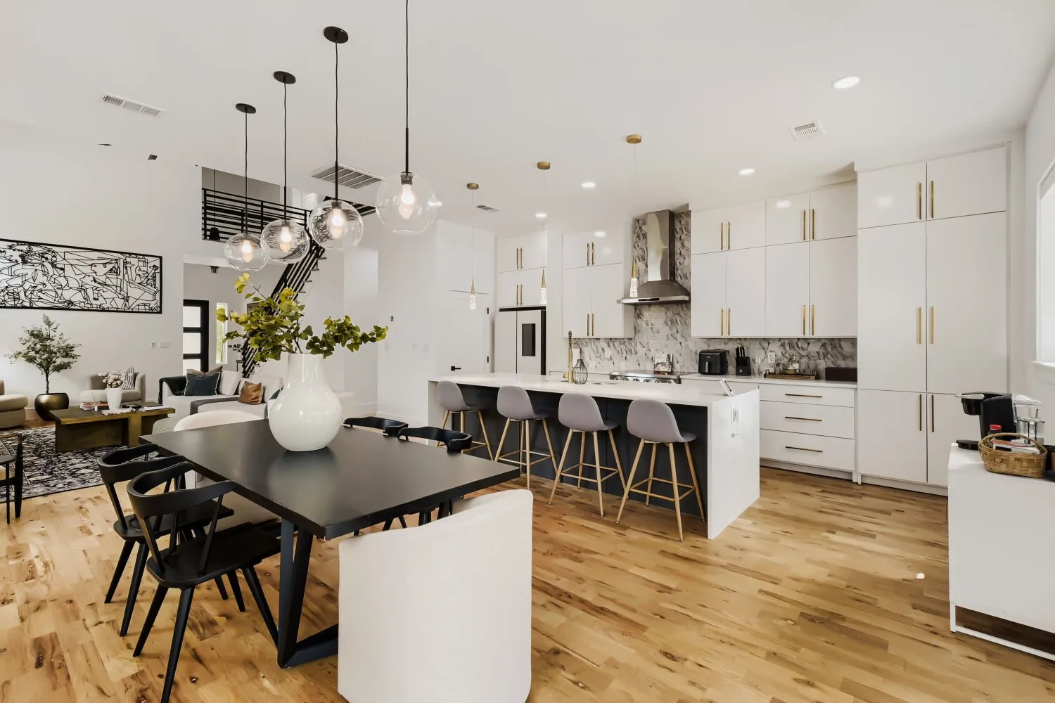 Dining area with light wood-style flooring and recessed lighting