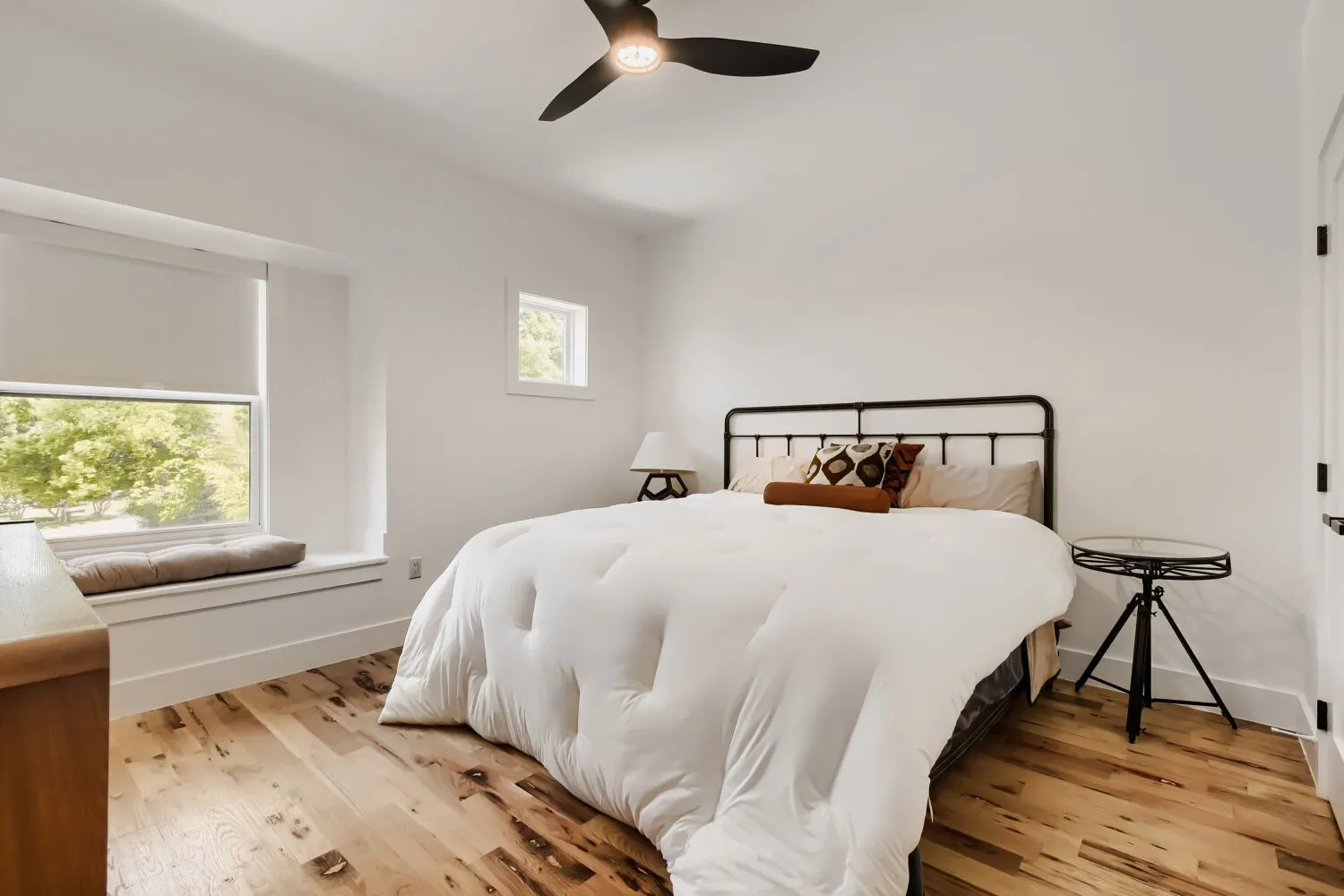 Bedroom featuring light wood-style floors and ceiling fan