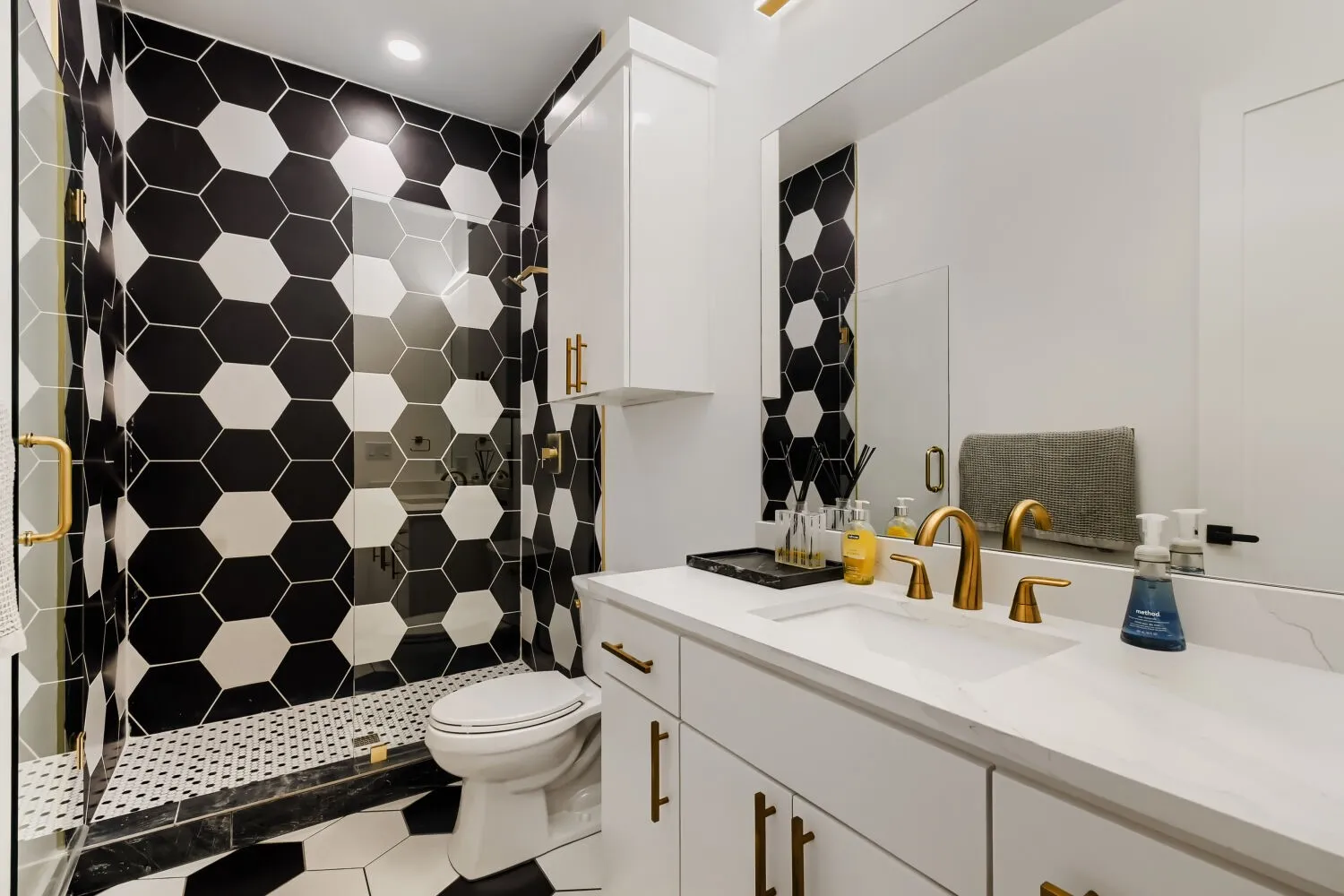 Full bath featuring vanity and a shower stall