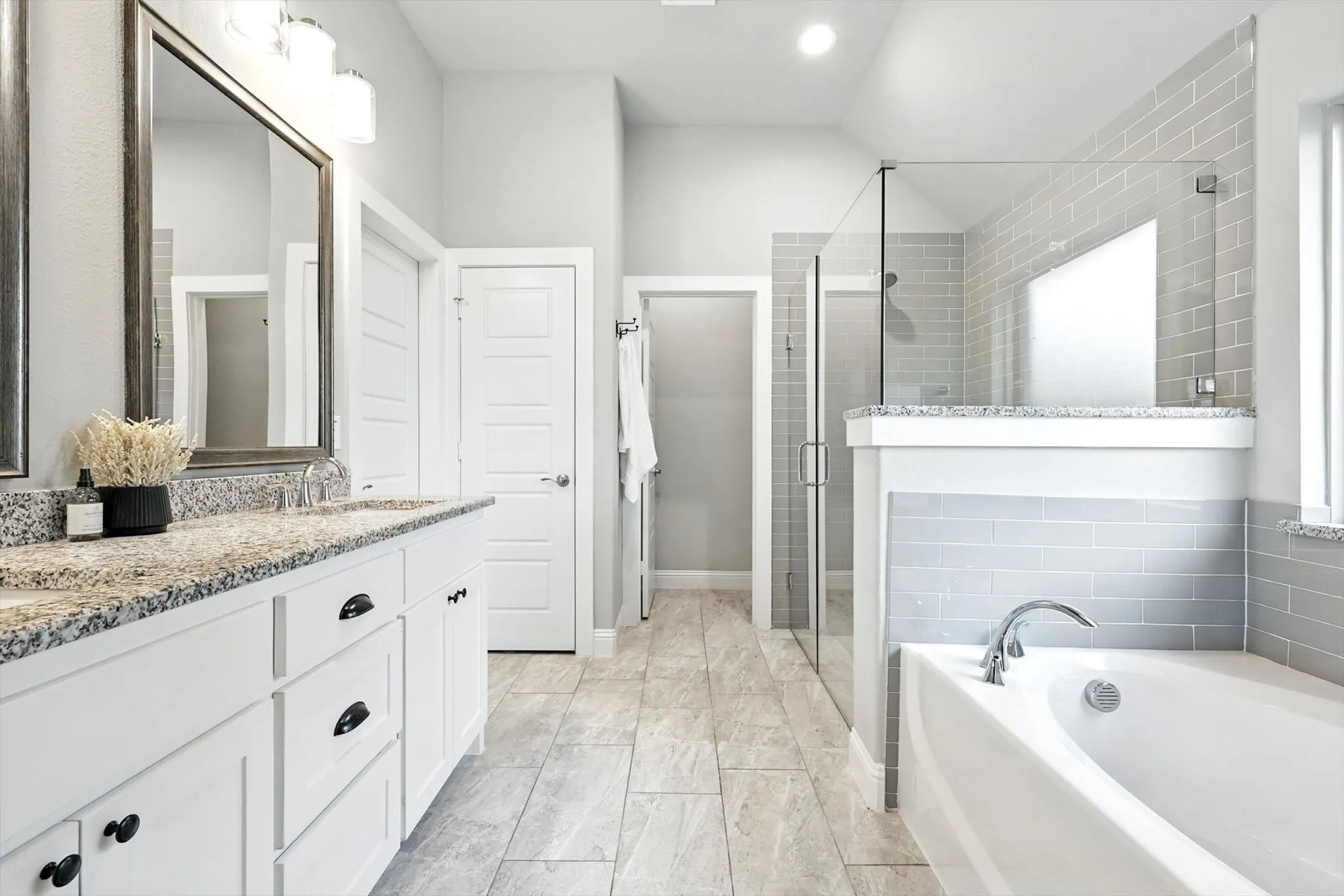 Walk in closet, linen closet, garden tub and standalone shower.