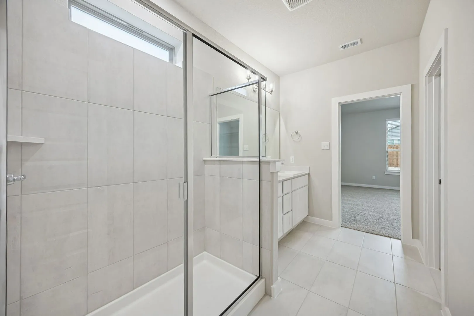 Primary Bathroom in the Stanley II home plan by Trophy Signature Homes – REPRESENTATIVE PHOTO