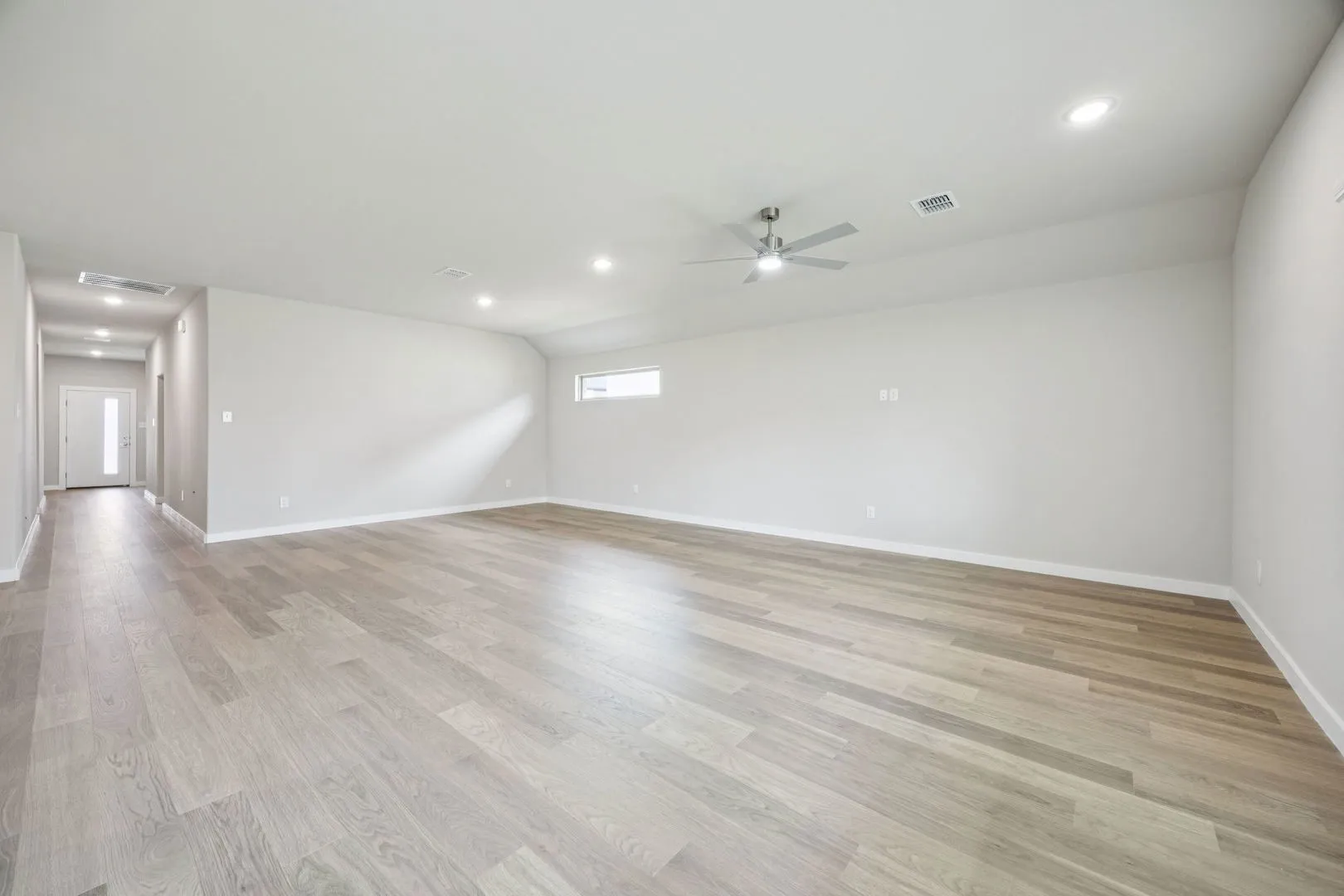 Dining and Living Room in the Hayden home plan by Trophy Signature Homes – REPRESENTATIVE PHOTO