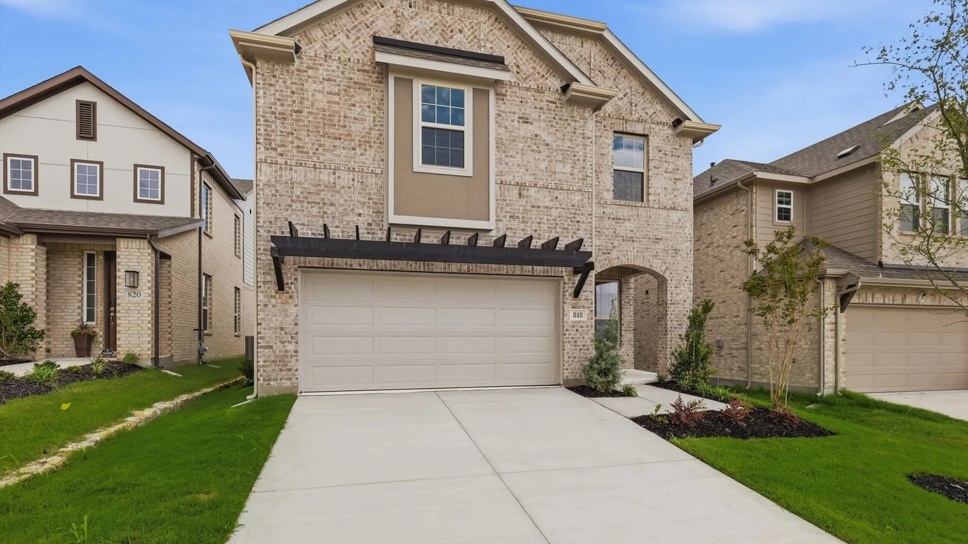 Two-story residence featuring brick and siding exterior construction