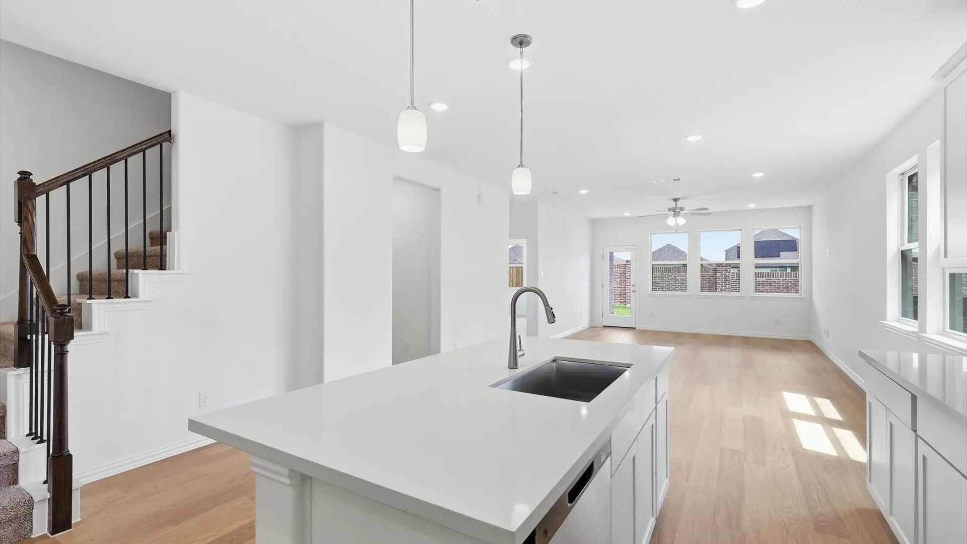 Kitchen island with an undermount sink and gooseneck faucet