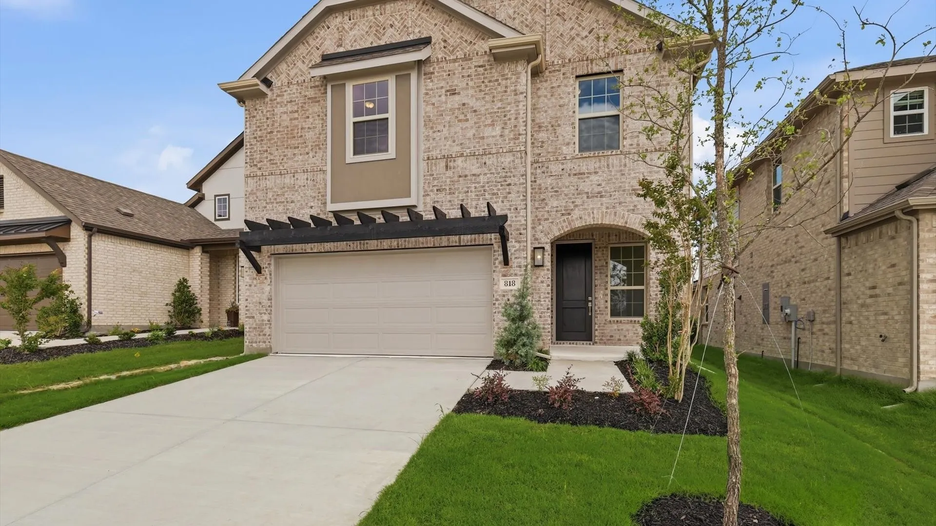 Light brick facade with darker trim accents