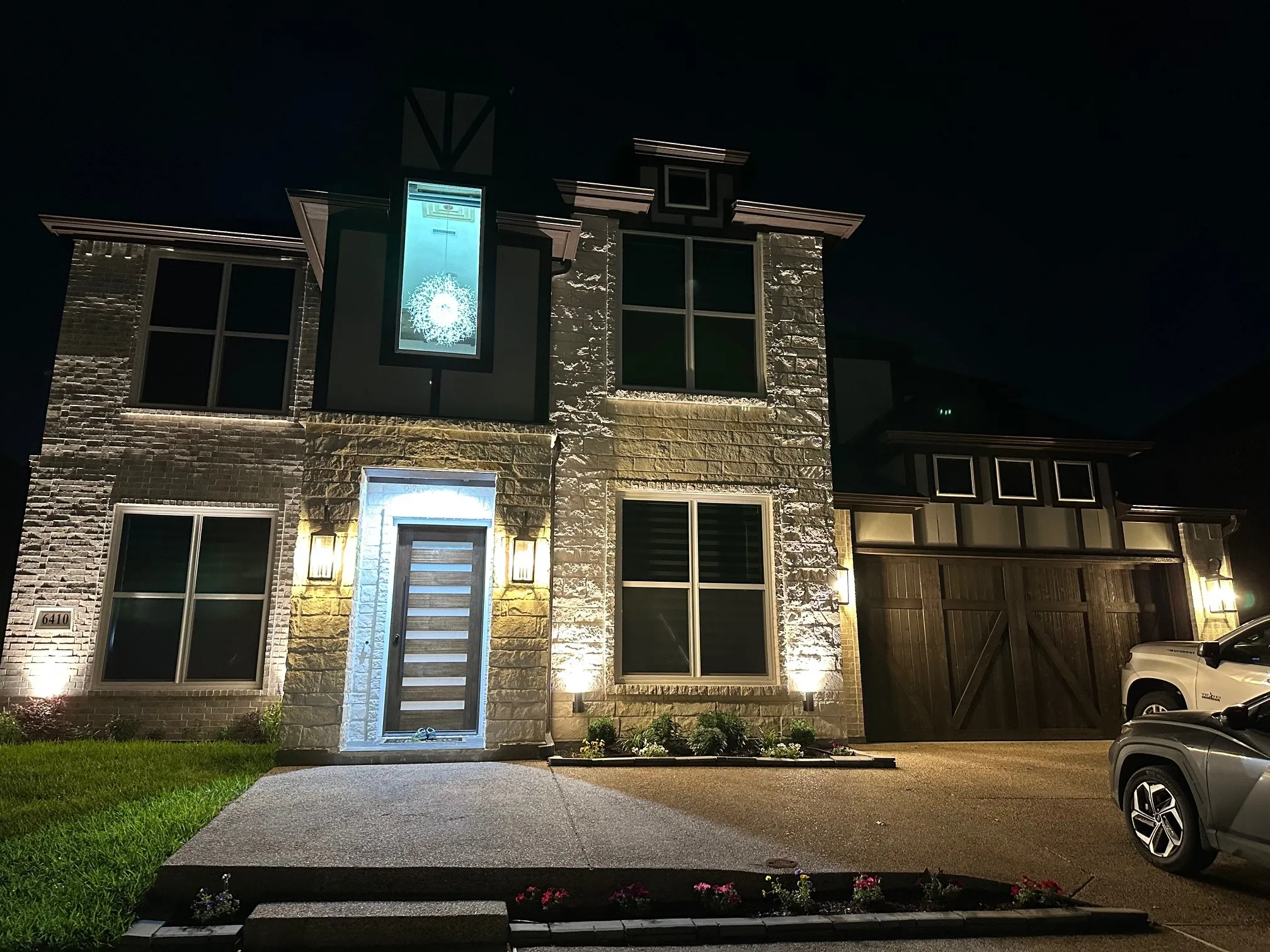 Modern home with a garage and brick siding