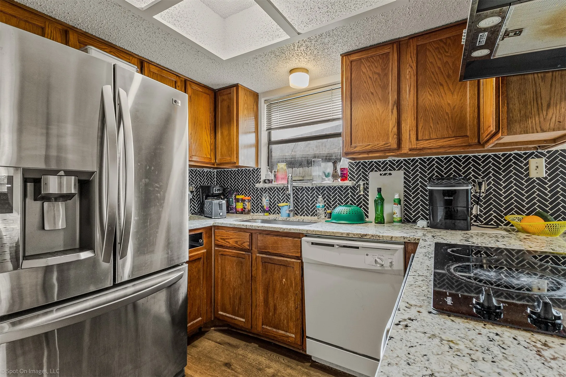 Unit B kitchen showing backsplash and cooktop