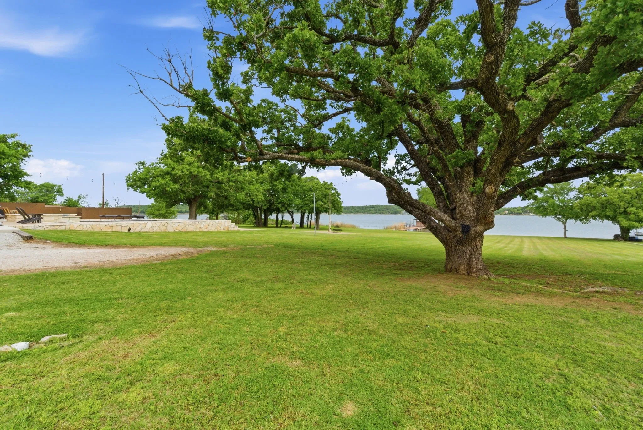 Huge yard with mature trees & views of the lake