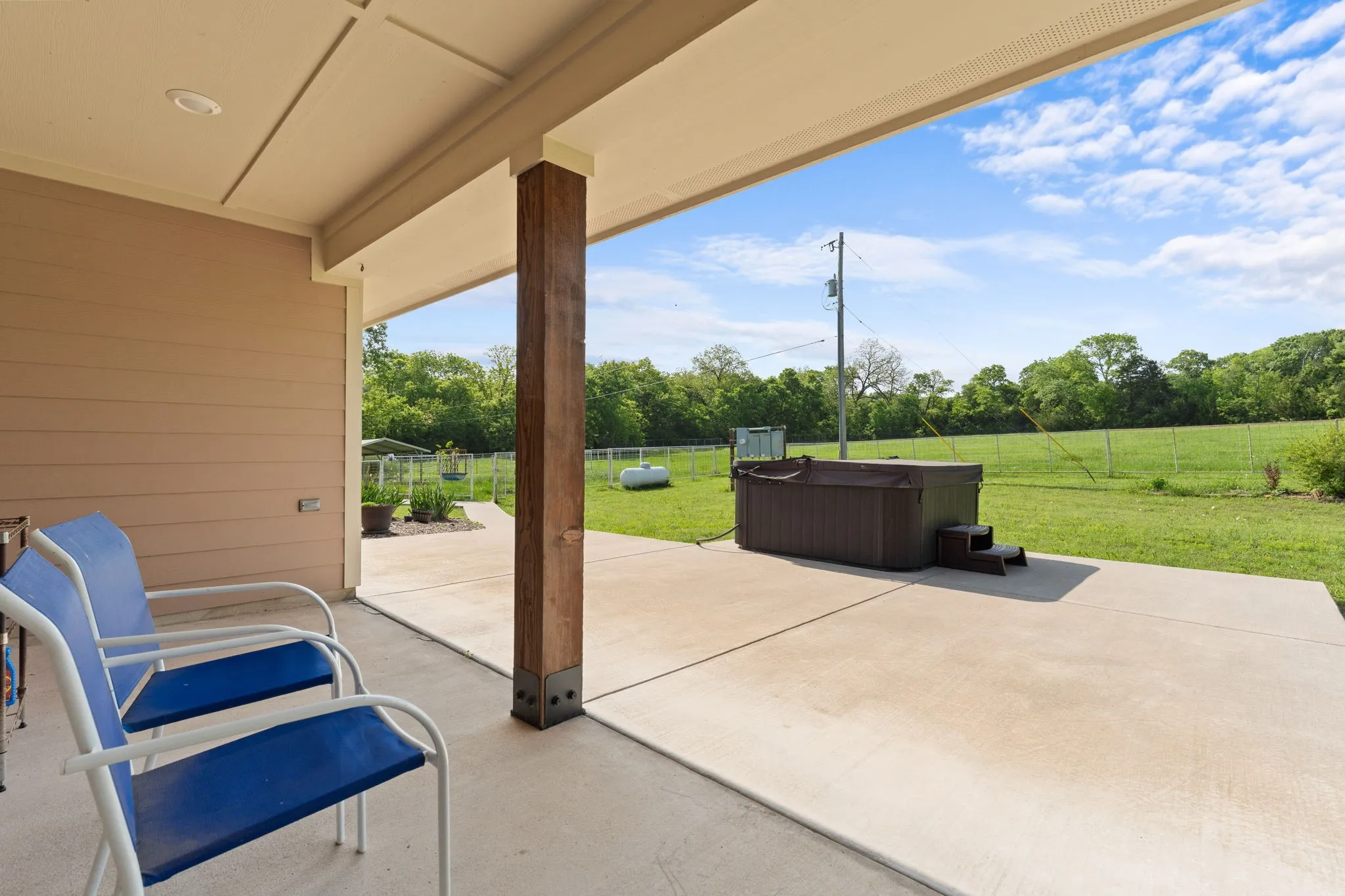 Covered patio view of jacuzzi and pasture