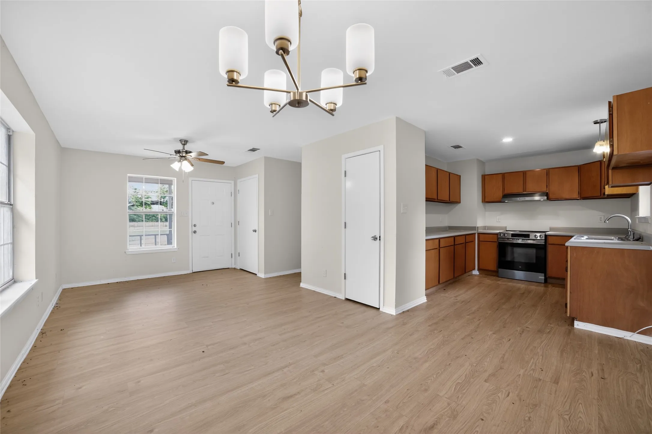 Open concept living space featuring light wood-style flooring throughout