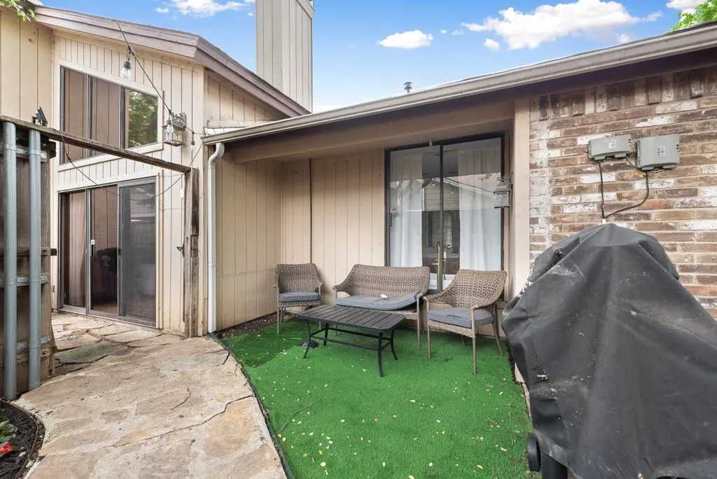 The patio offers a secluded outdoor setting with space to relax or entertain.