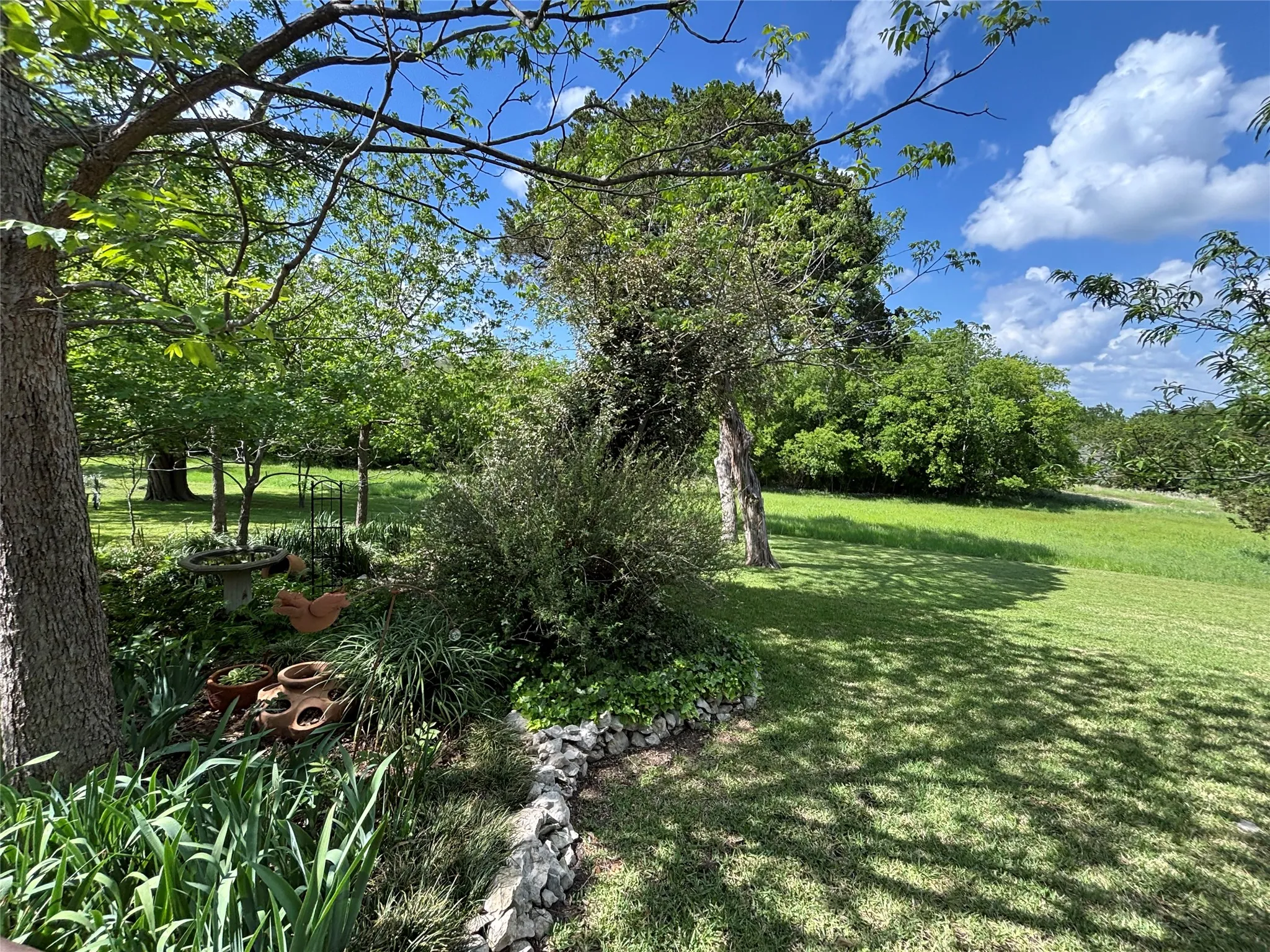 expansive yard views to and beyond the lake
